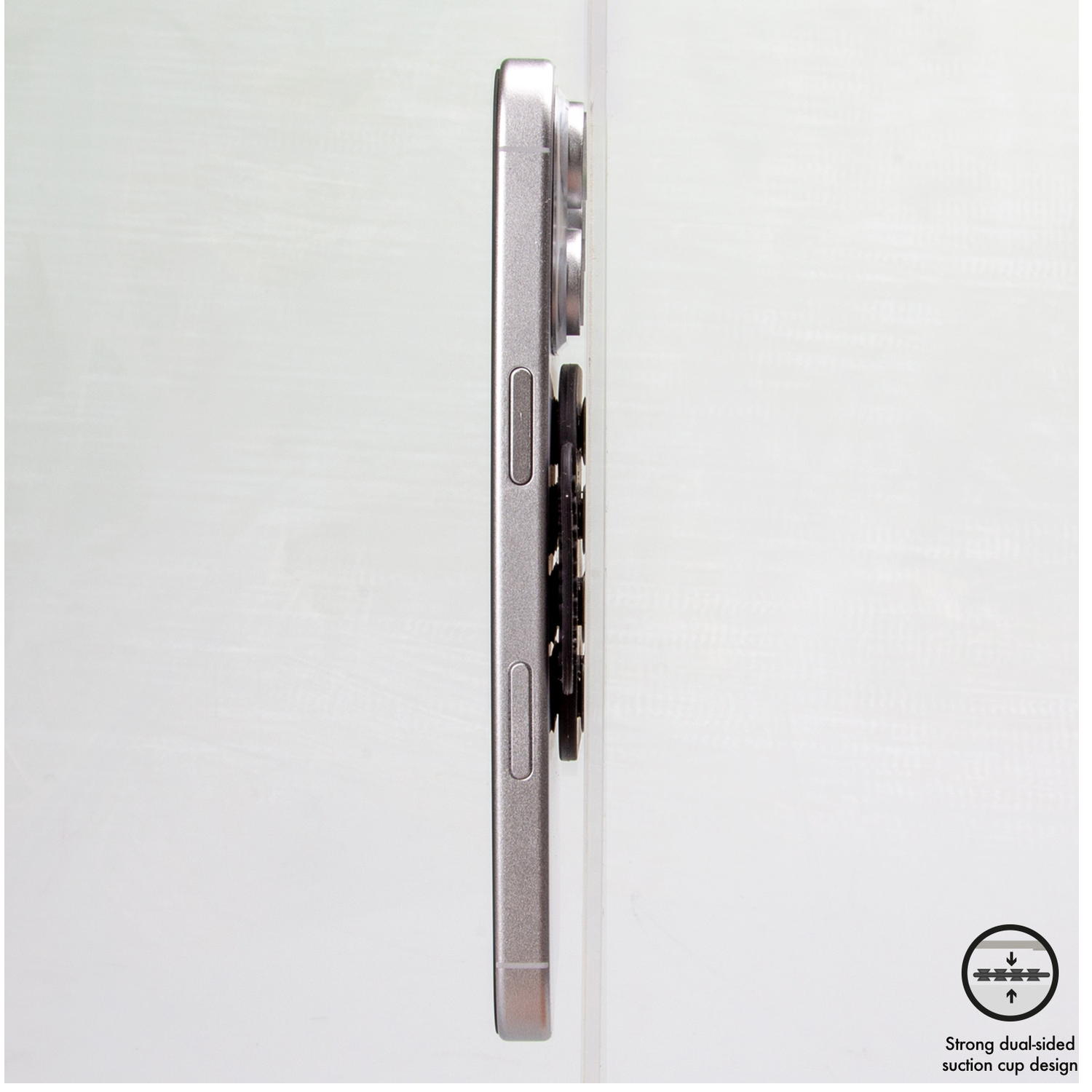 Silver smartphone with black suction cup mount on its side, against a light background.