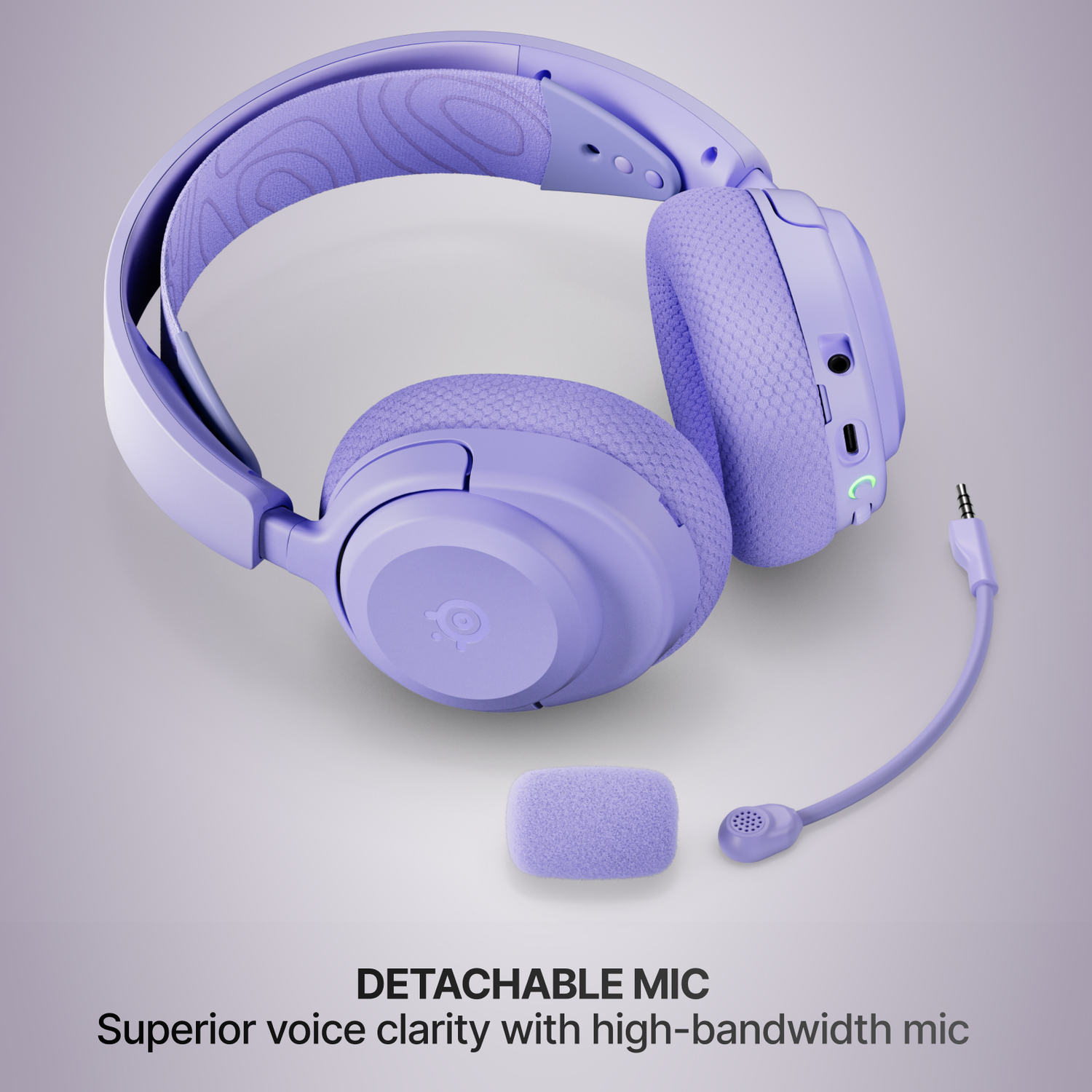 Purple headphones with a detachable microphone and padded headband.