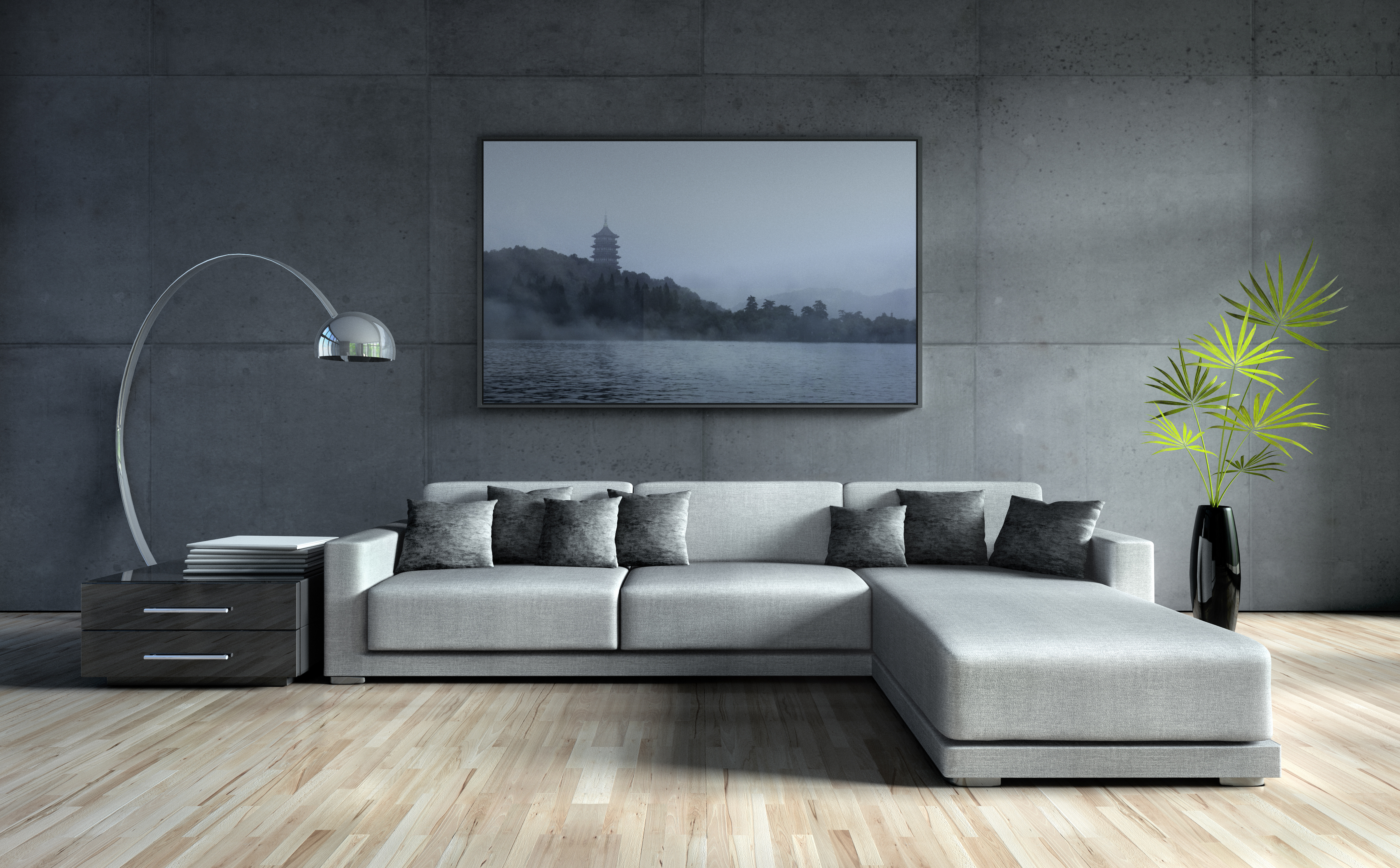 Graues Ecksofa vor Betonwand mit Bild einer Pagode am See.