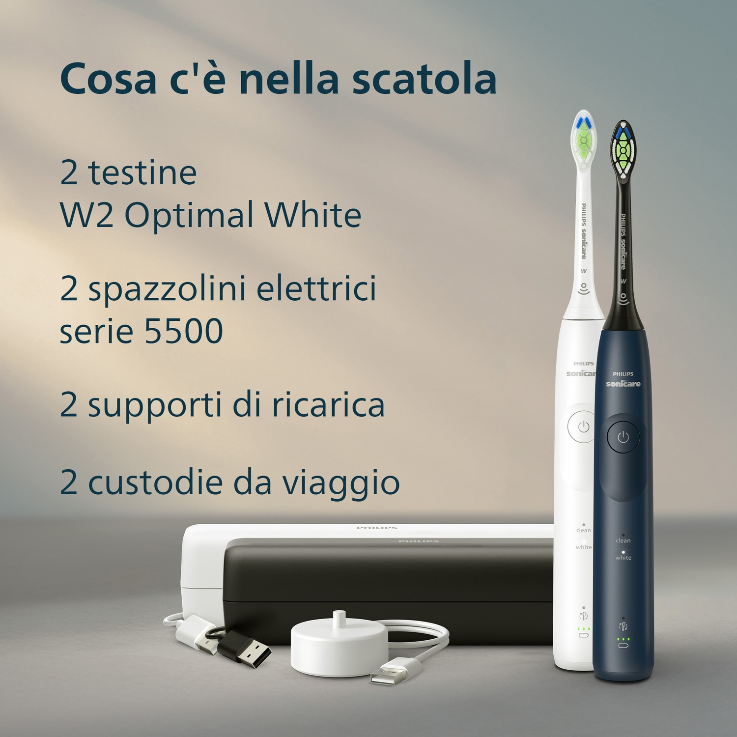 Due spazzolini elettrici, bianco e blu scuro, con caricabatterie e custodie da viaggio.