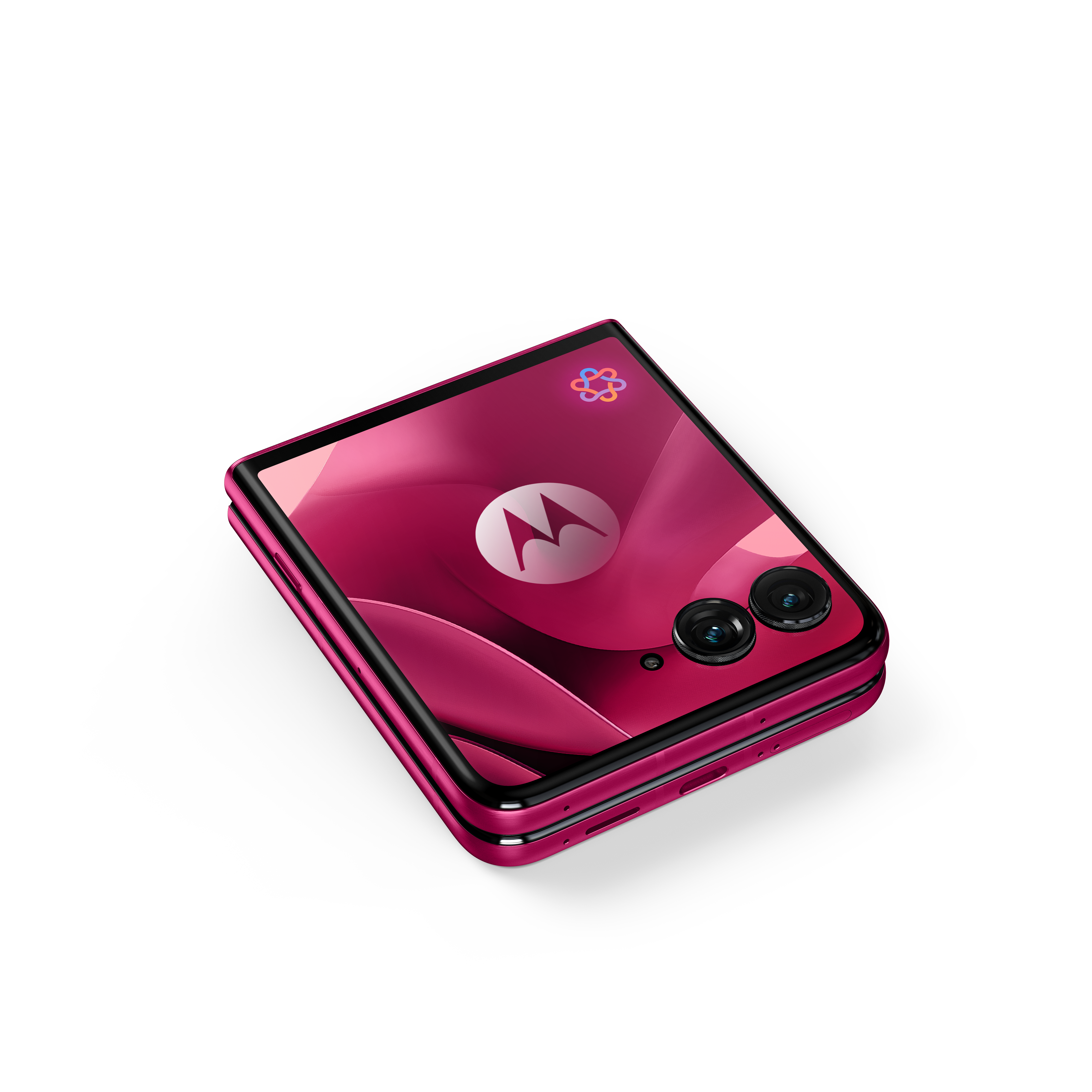 Zamknięty, różowy telefon z klapką z logo Motoroli na ekranie.