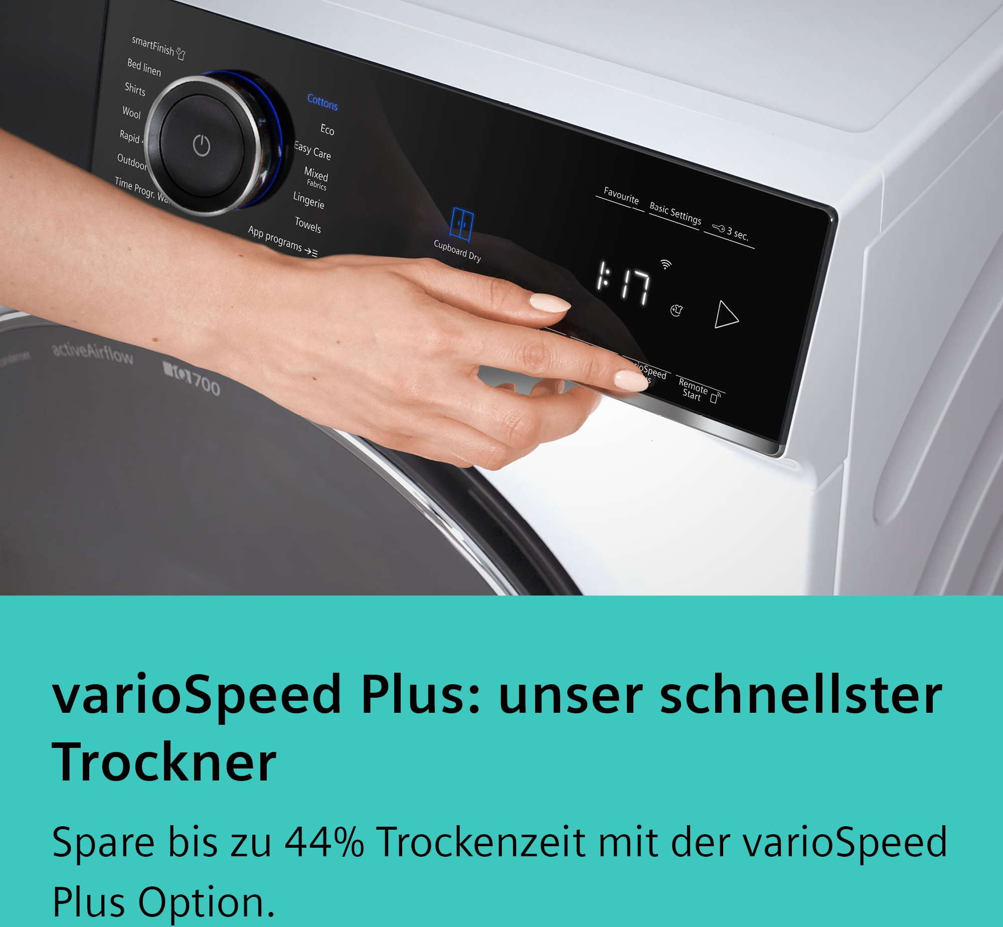 Eine Hand wählt ein Programm auf dem Bedienfeld eines Wäschetrockners.