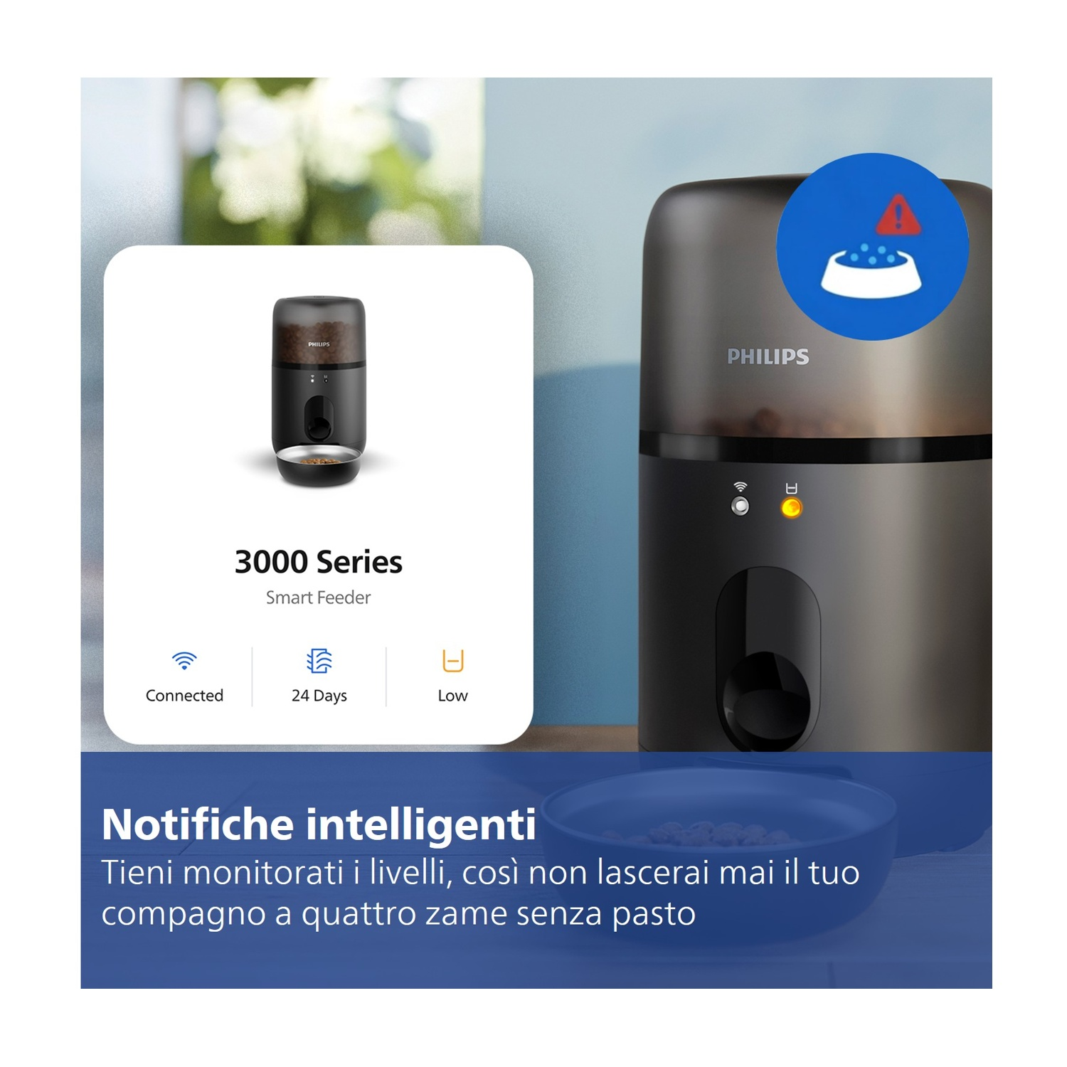Un alimentatore intelligente Philips nero con cibo e un'icona di avviso di basso livello.