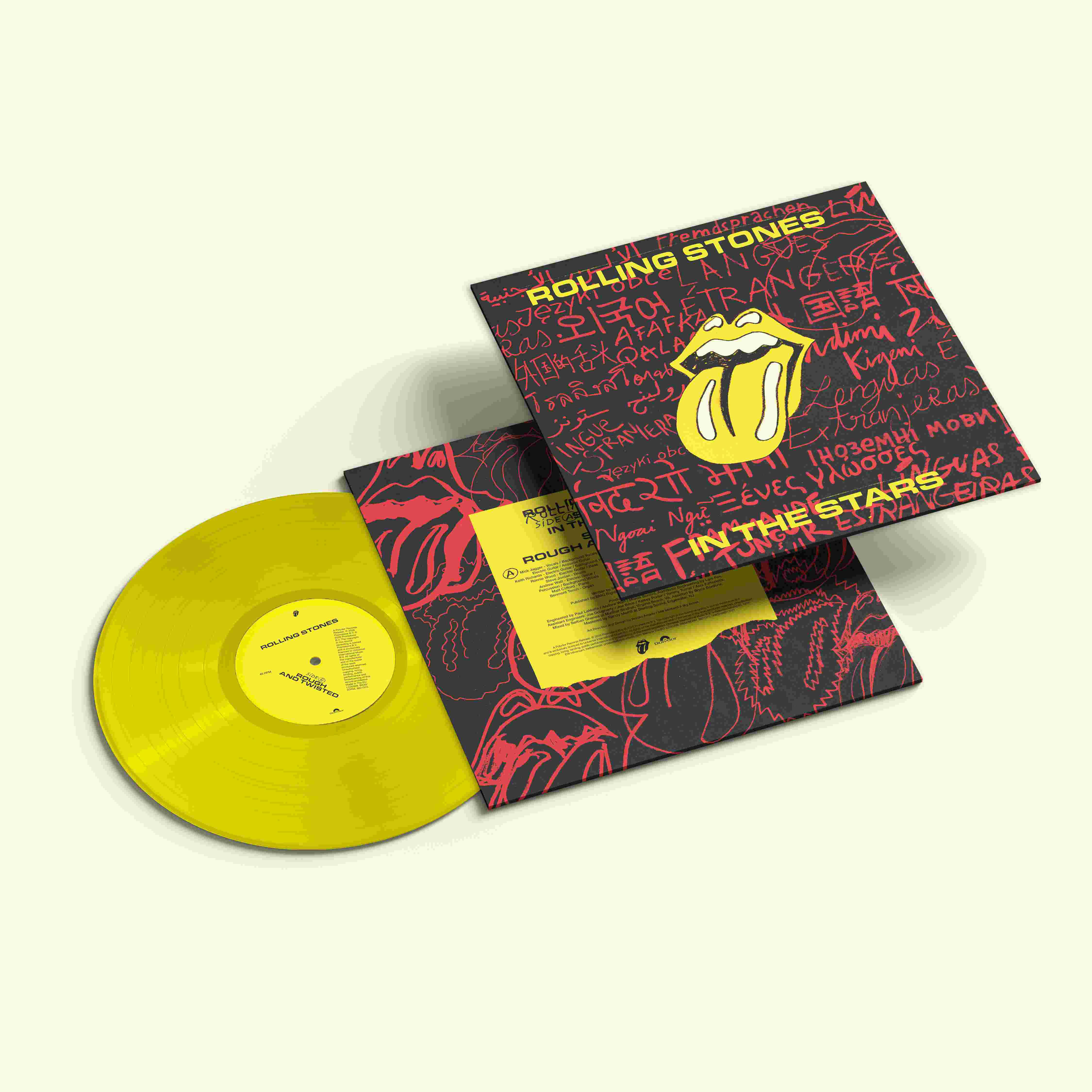 Gelbe Schallplatte und Albumcover von The Rolling Stones mit Zunge-Logo und Texten in vielen Sprachen.