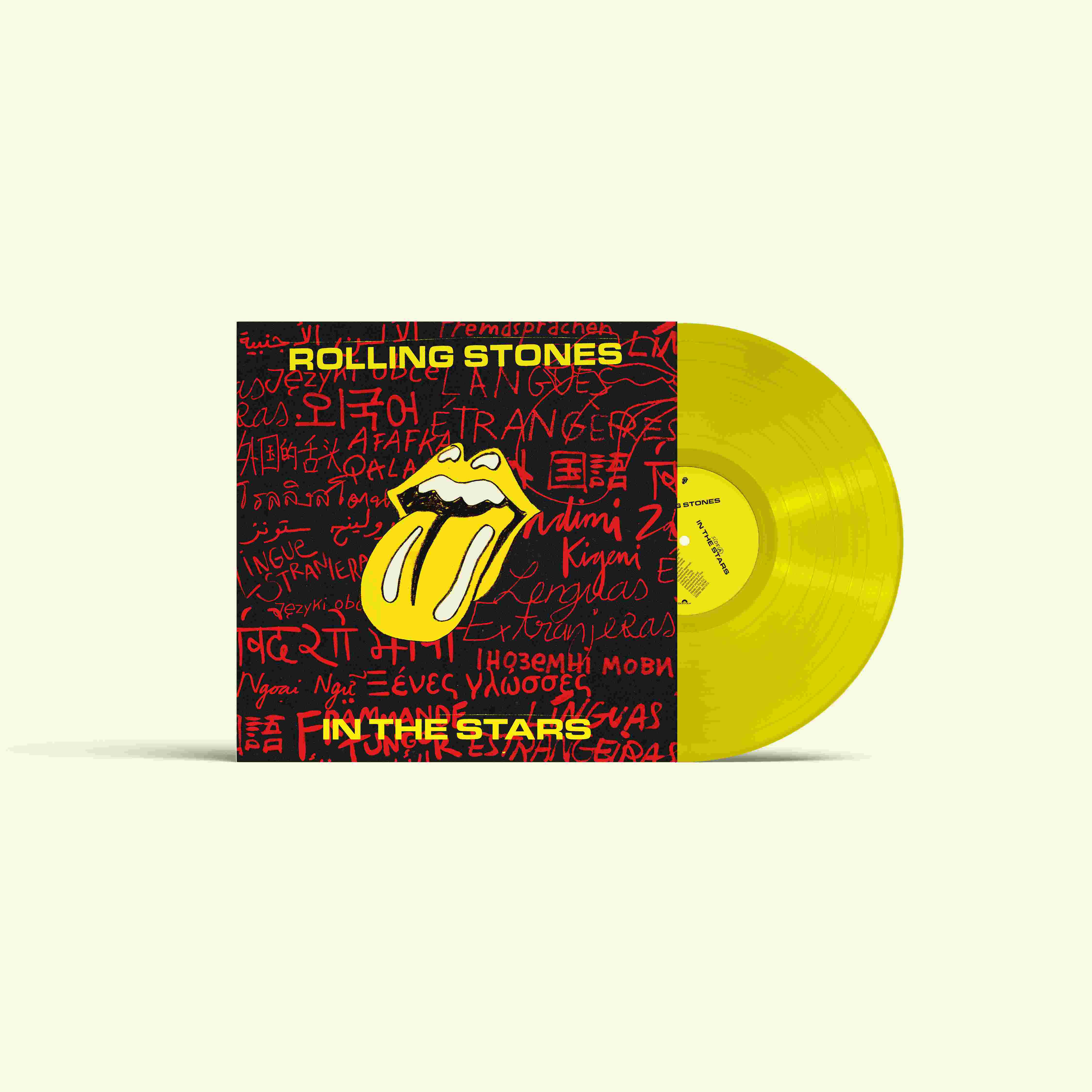 Gelbe Rolling Stones Schallplatte mit Cover in verschiedenen Sprachen.