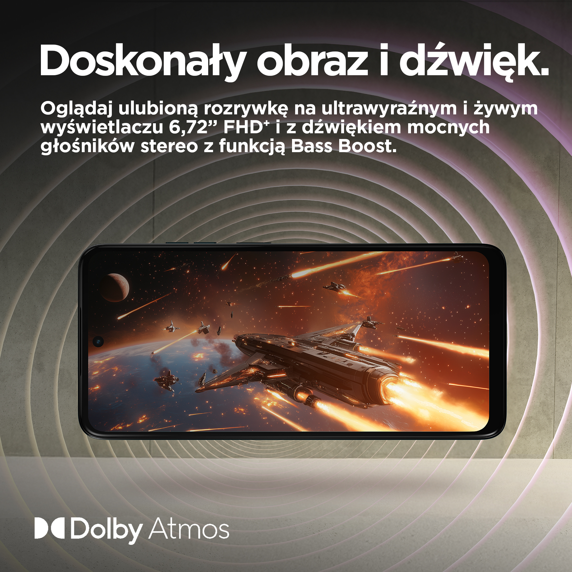 Smartfon wyświetla bitwę kosmiczną ze statkami i planetami. Logo Dolby Atmos na dole.
