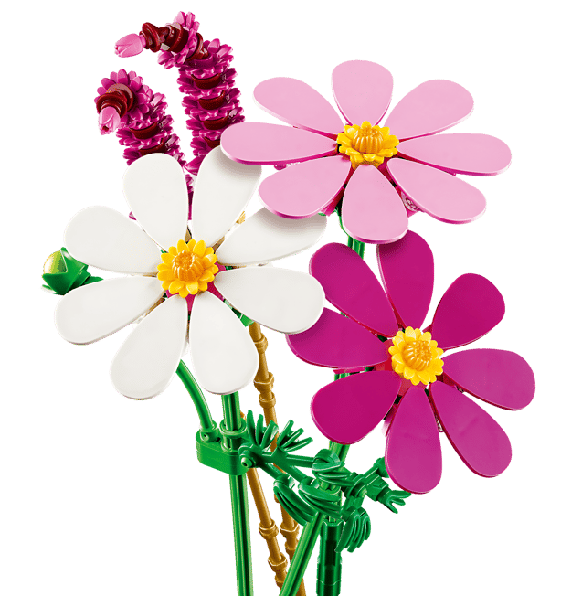 Ein Strauß bunter Spielzeugblumen: pinke, weiße und magentafarbene Gänseblümchen mit gelben Zentren.