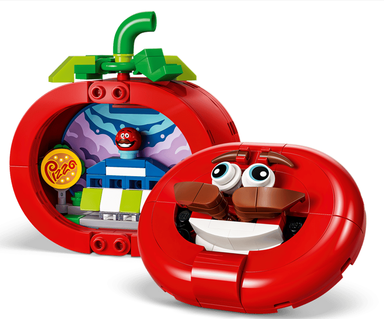 Ein rotes Lego-Tomatenhaus mit einem lustigen Gesicht und einem Pizza-Schild.