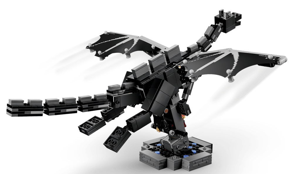 Schwarzer Lego-Drache mit ausgebreiteten Flügeln auf einem Sockel.
