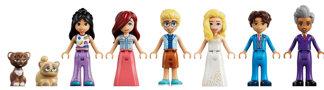 Eine Gruppe von Lego-Figuren und Tieren, von links nach rechts: braune Katze, beige Katze, Mädchen in Lila, Mädchen in Rosa, Junge mit Brille, Mädchen im weißen Kleid, Junge im blauen Anzug, Mann im lila Anzug.