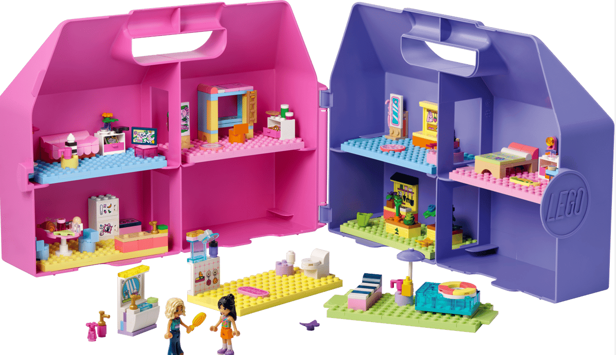 Zwei offene LEGO-Puppenhäuser, pink und lila, mit Möbeln und Minifiguren.