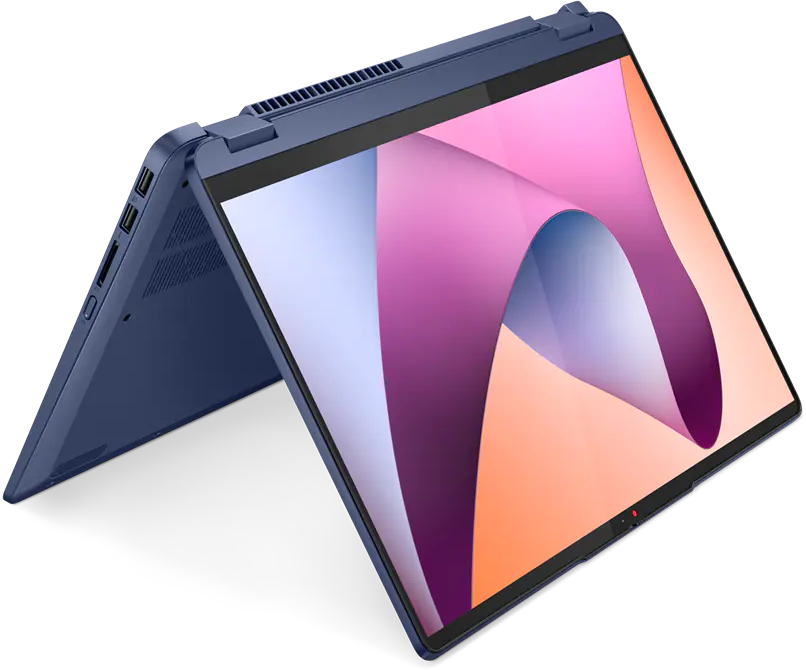 Egy sötétkék laptop nyitva van, képernyőjén absztrakt, színes háttér látható.
