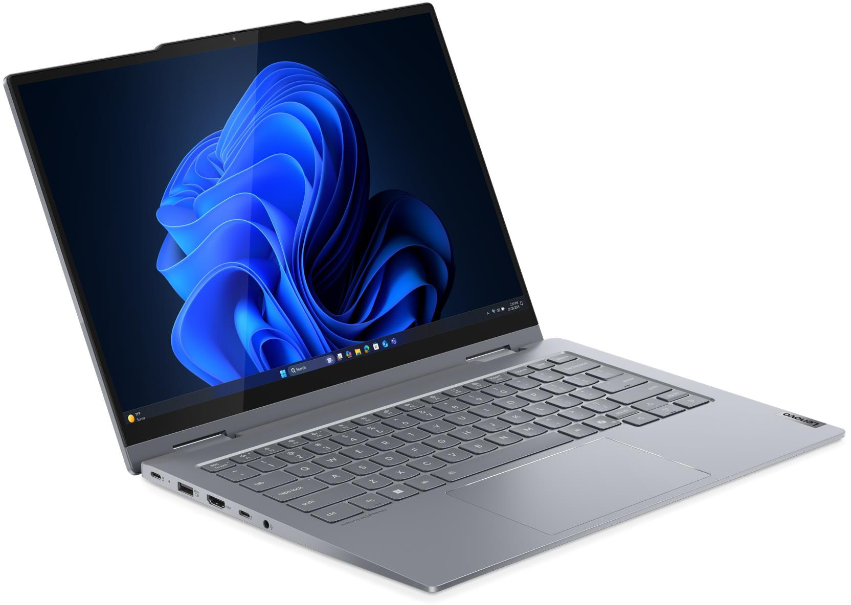 Egy ezüst laptop kék absztrakt háttérképet jelenít meg a képernyőjén.