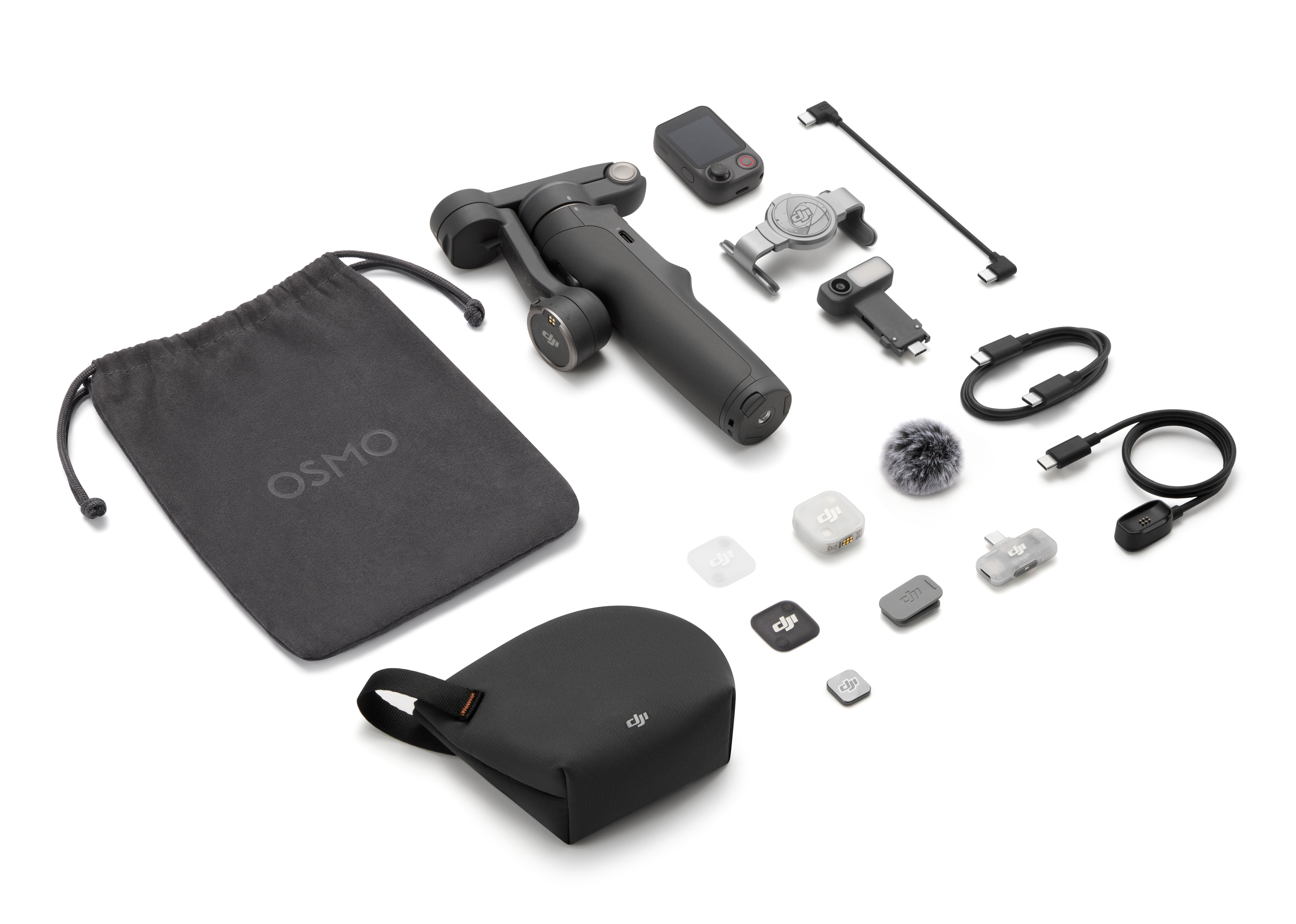 Stabilizator kamery DJI Osmo z akcesoriami, kablami i torbami na białym tle.