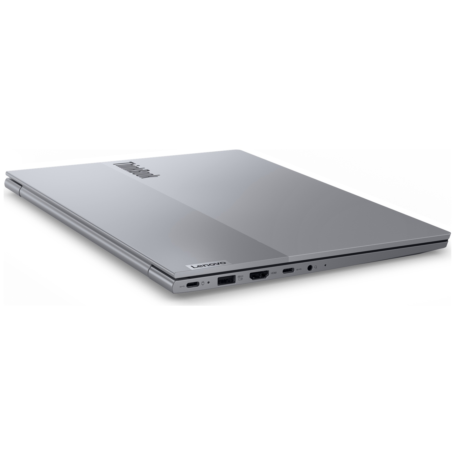 Een gesloten, zilveren Lenovo laptop met ThinkBook-logo op de klep.