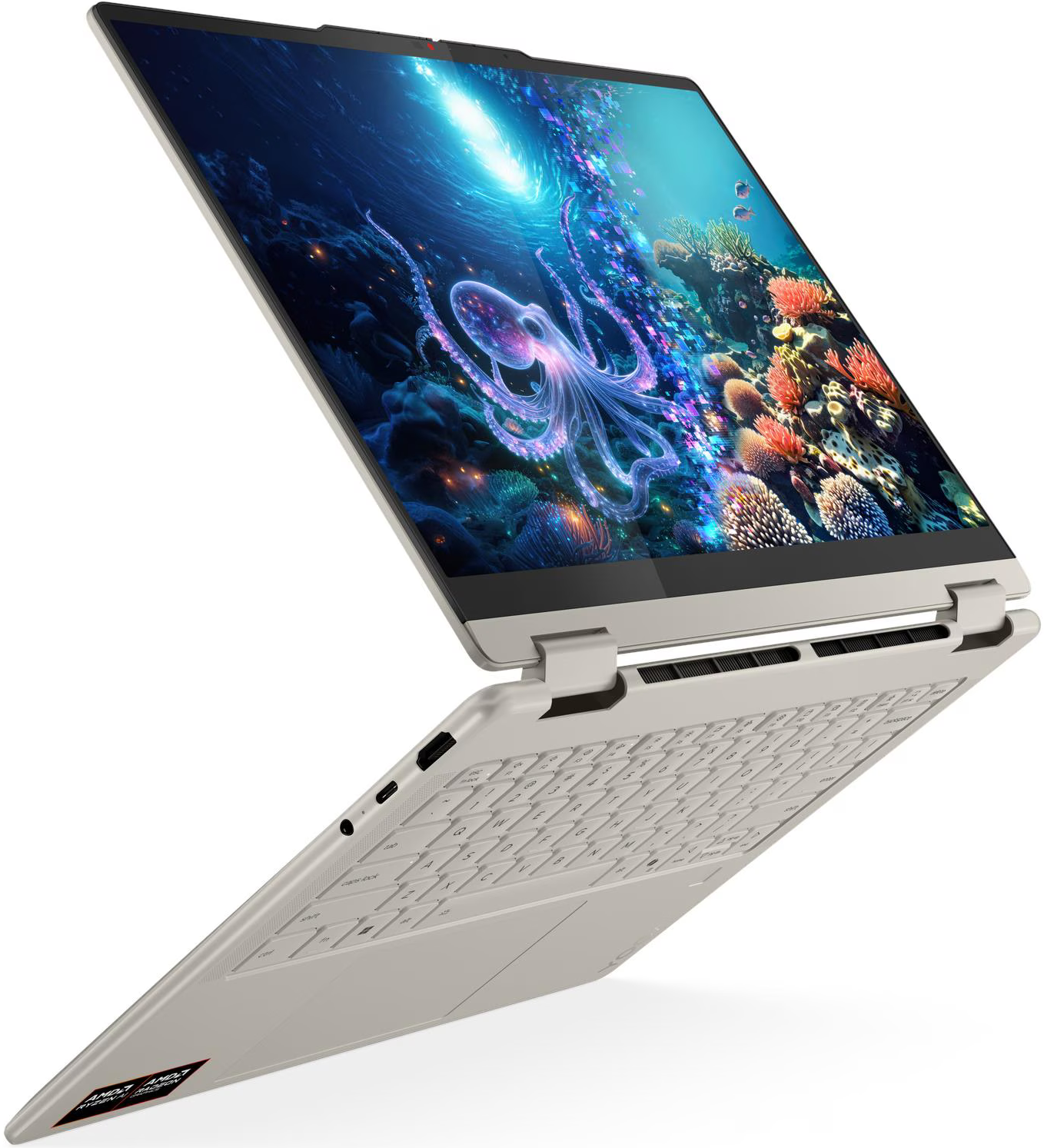 Egy nyitott laptop képernyőjén egy polipot és korallokat ábrázoló víz alatti jelenet látható.