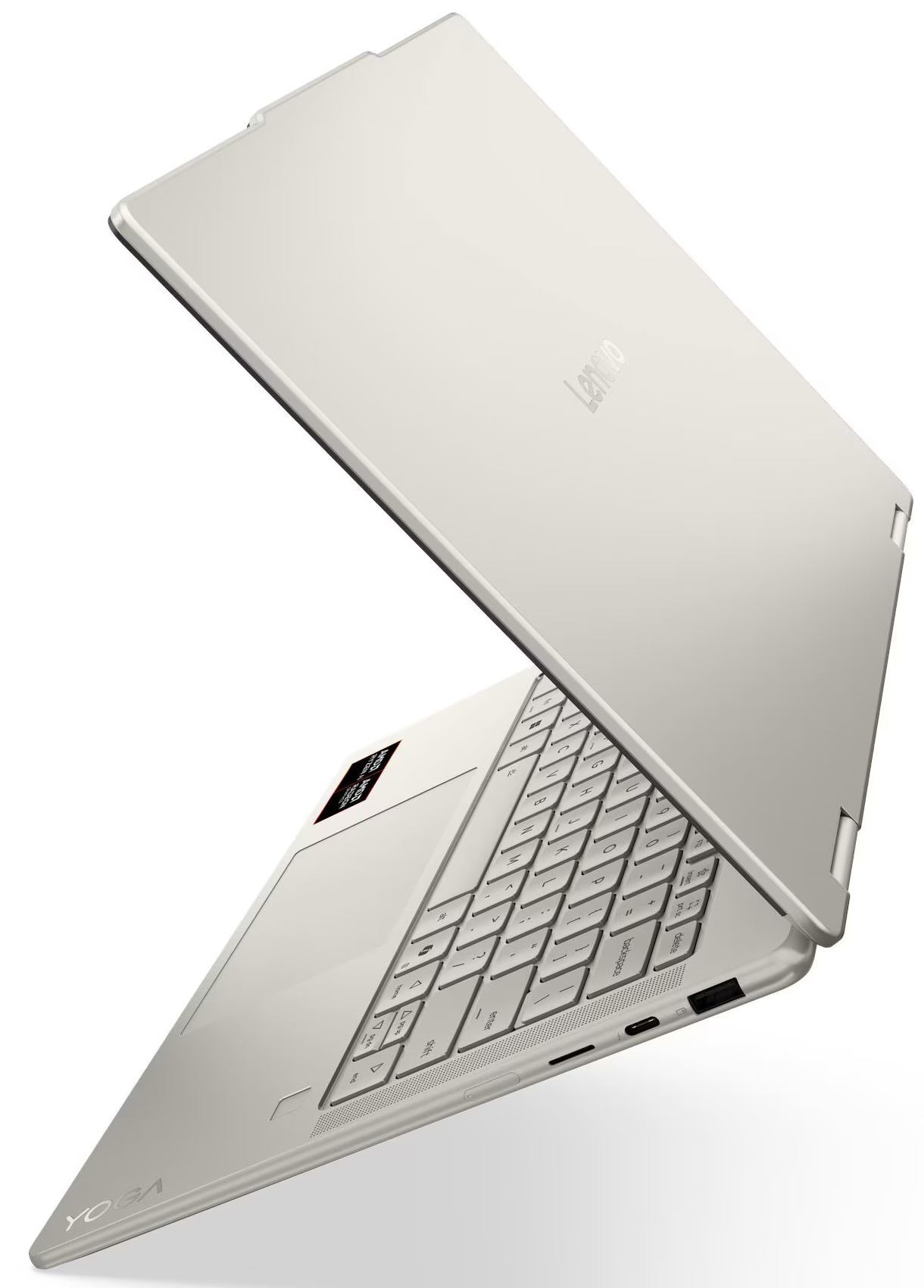 Egy ezüst Lenovo Yoga laptop nyitva, a billentyűzetet és az érintőpadot mutatja.