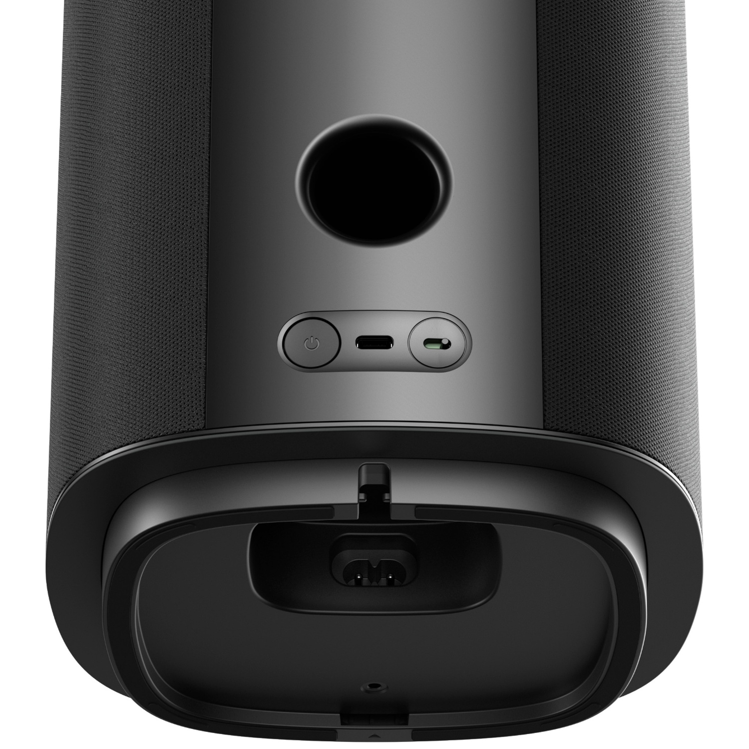 Back of a black speaker showing ports, buttons, and a circular vent.