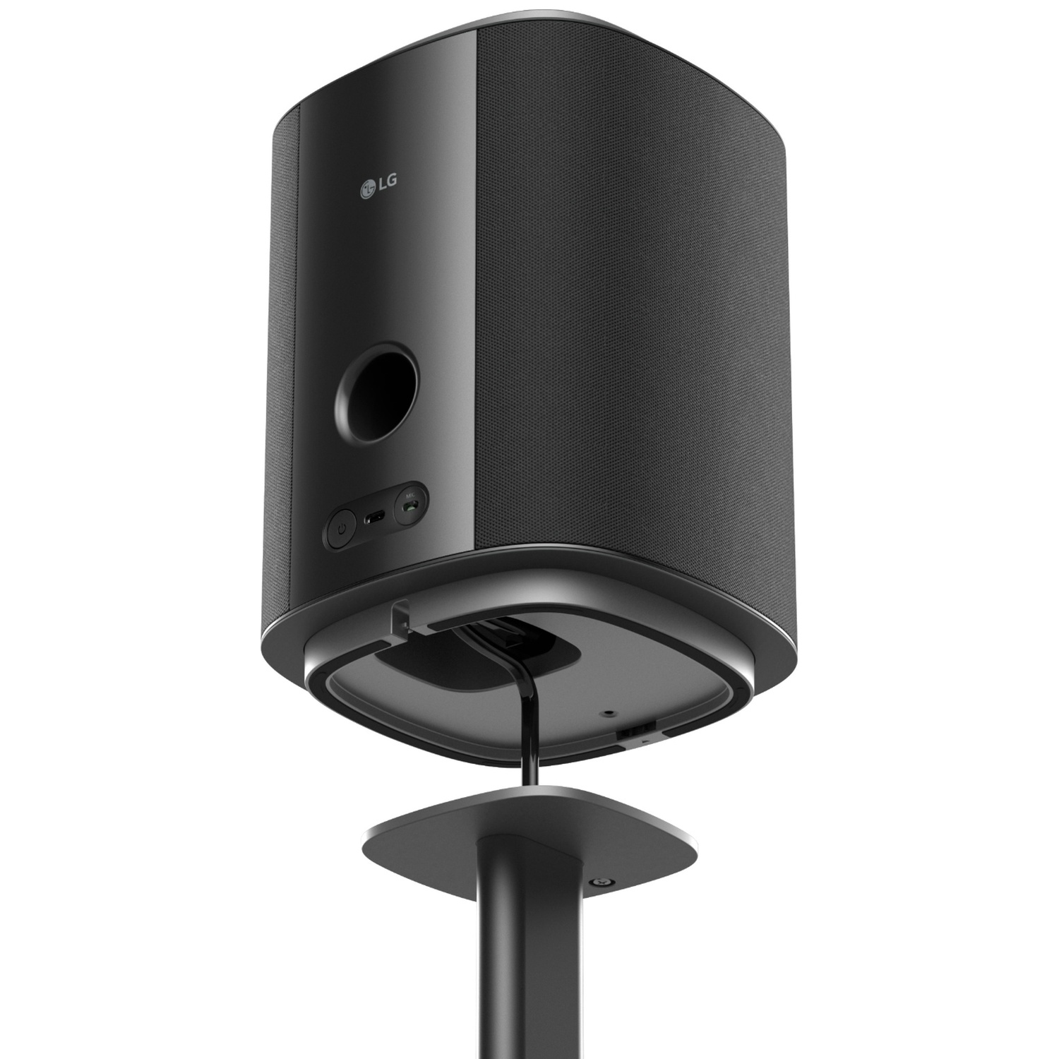 A black LG speaker with a circular port sits on a black stand against a white background.