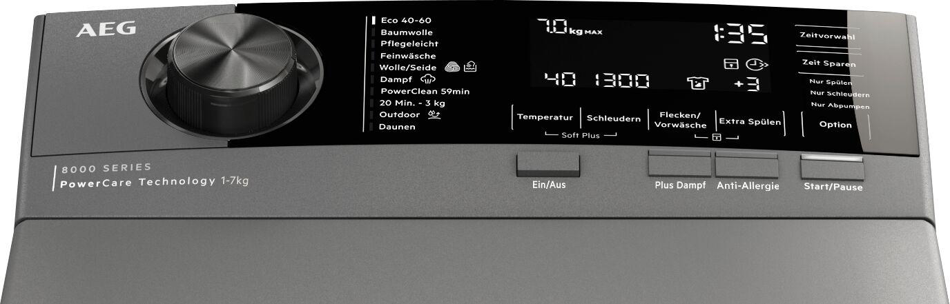 Bedienfeld einer AEG Waschmaschine mit Drehknopf, Display und Tasten.
