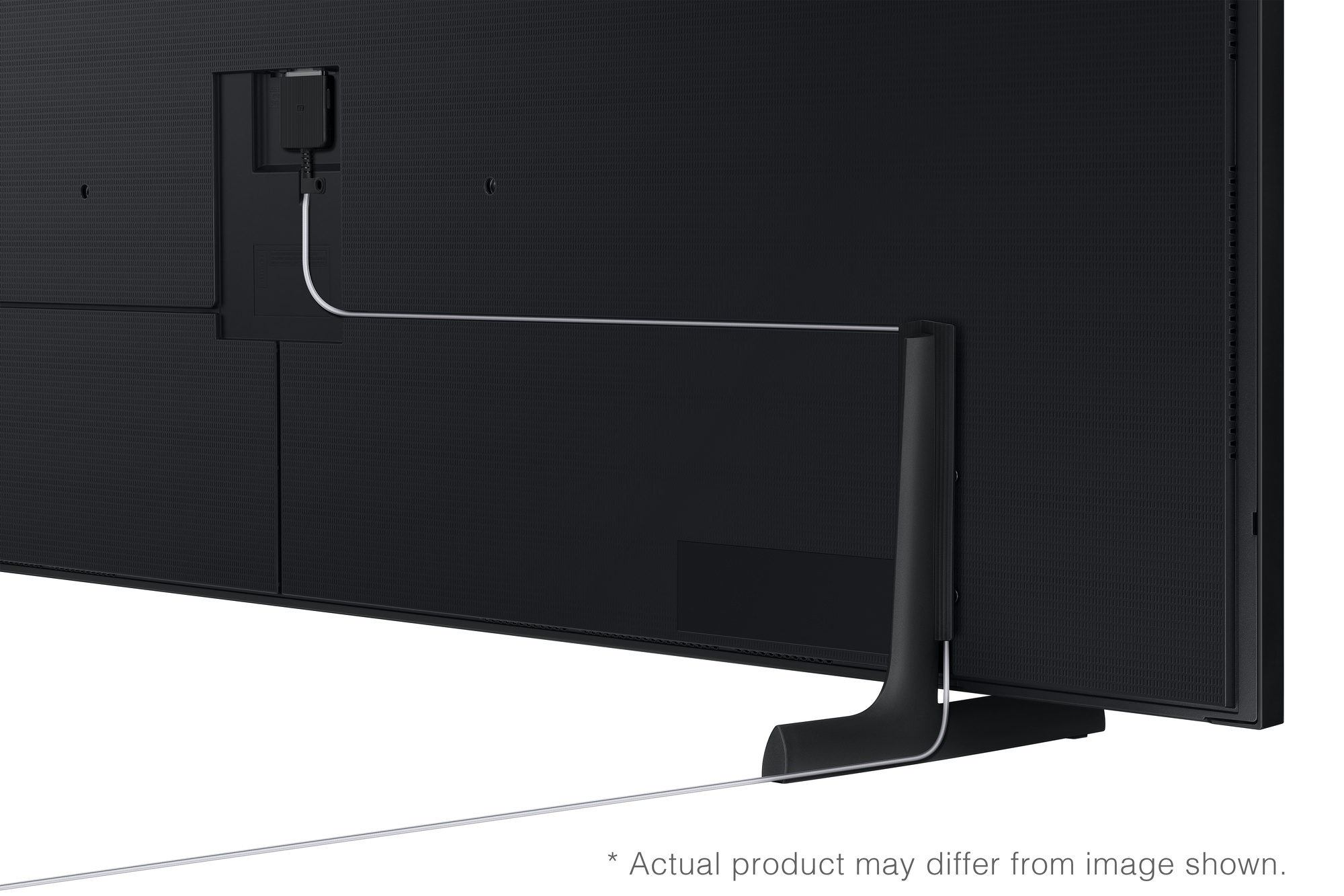 Parte trasera de un televisor negro con un cable que conduce a un soporte.