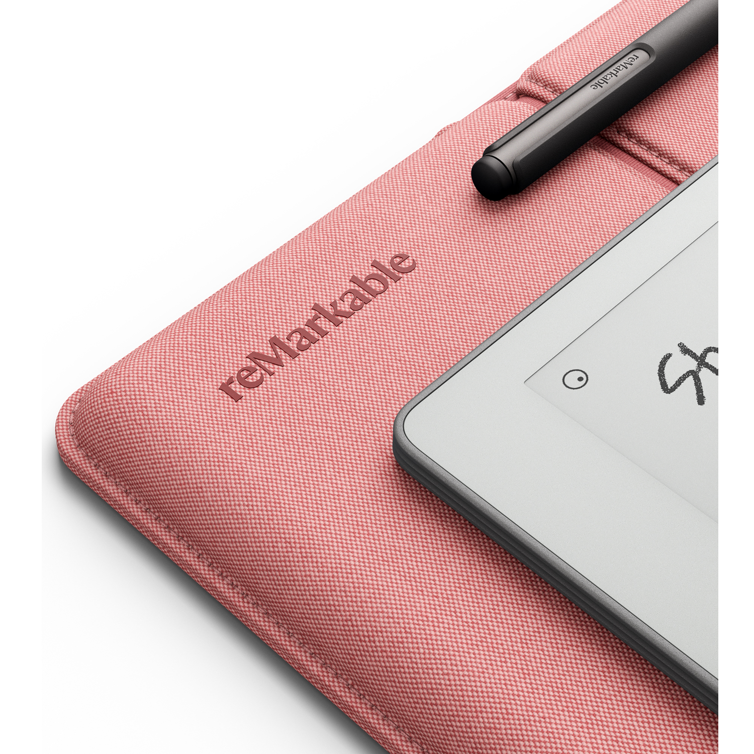 A pink ReMarkable cover with a stylus and e-reader.