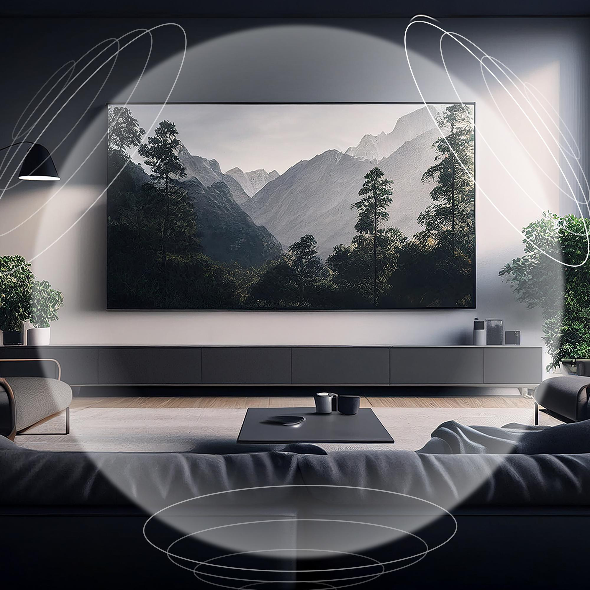 Ein modernes Wohnzimmer mit einem großen Fernseher, der Berglandschaften zeigt.