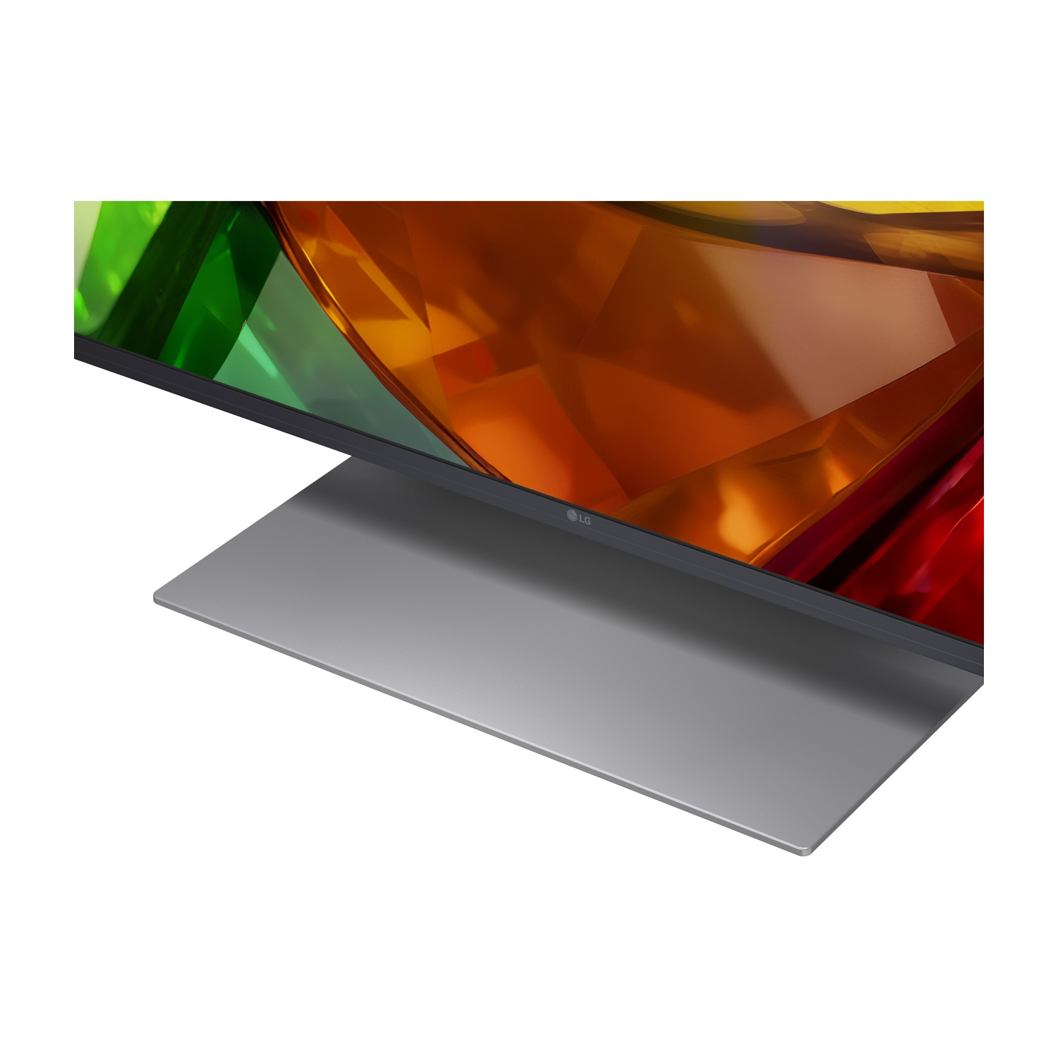 Una TV LG con una base grigia elegante e uno schermo con sfondo astratto e colorato.