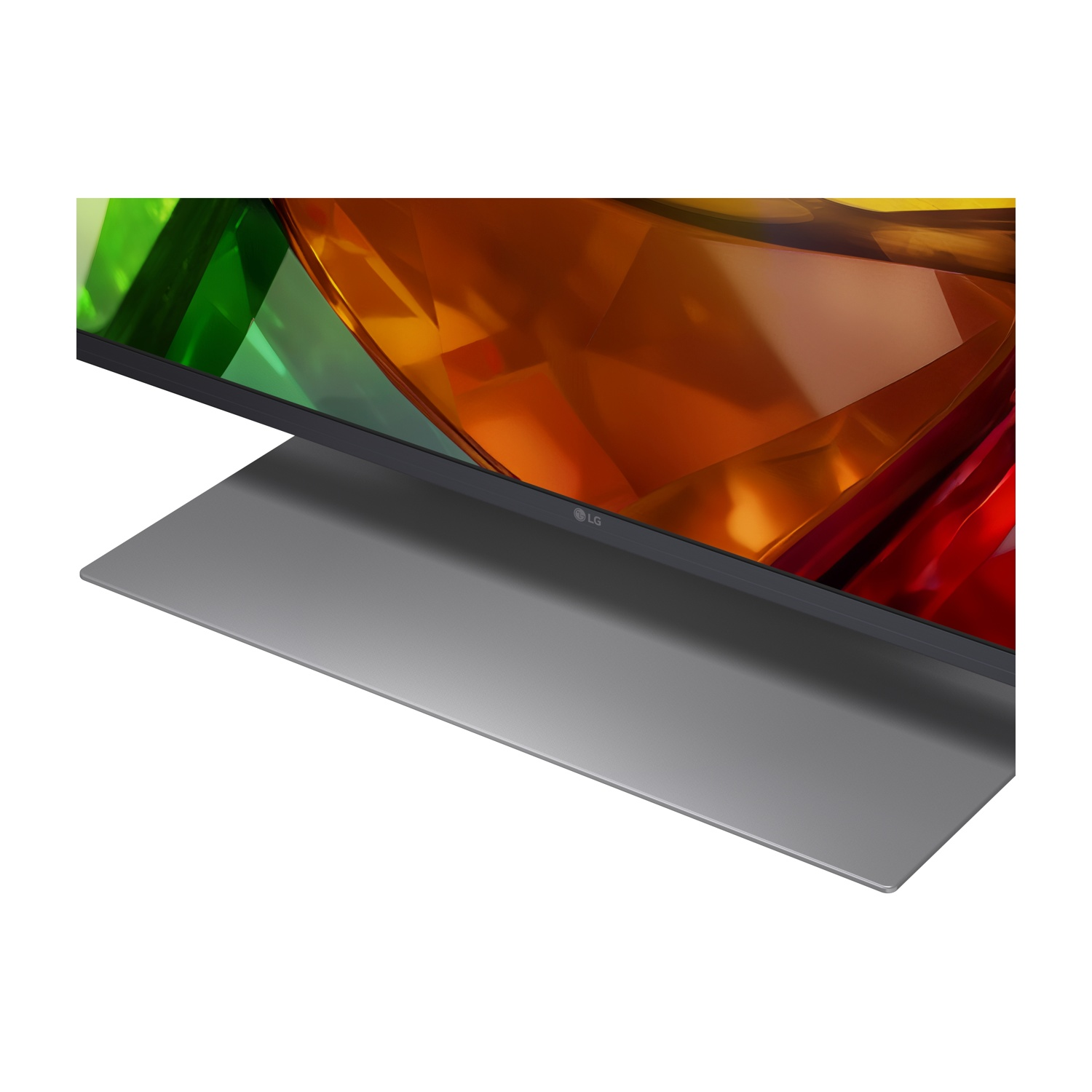 Un moderno televisore LG mostra un'immagine astratta colorata su un elegante supporto grigio.