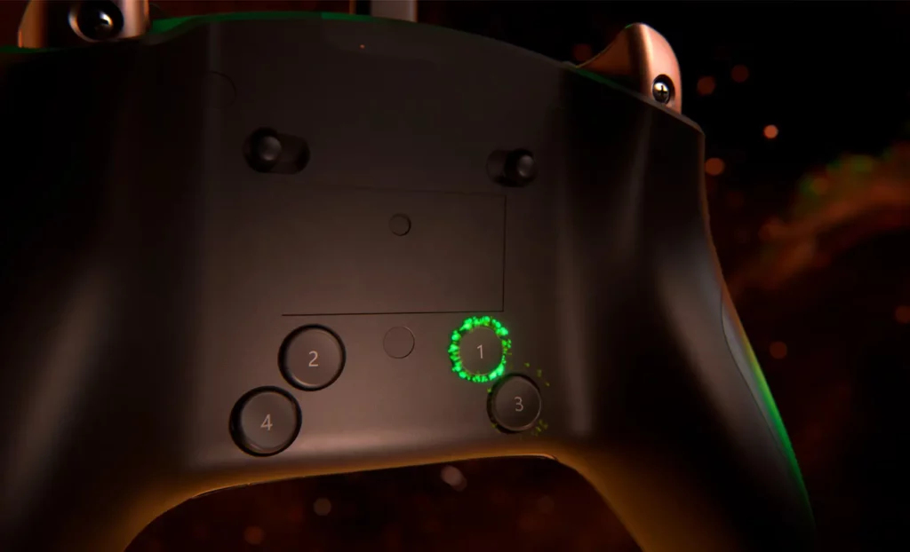 Controlador negro con números verdes brillantes 1, 2, 3, 4. Fondo oscuro.