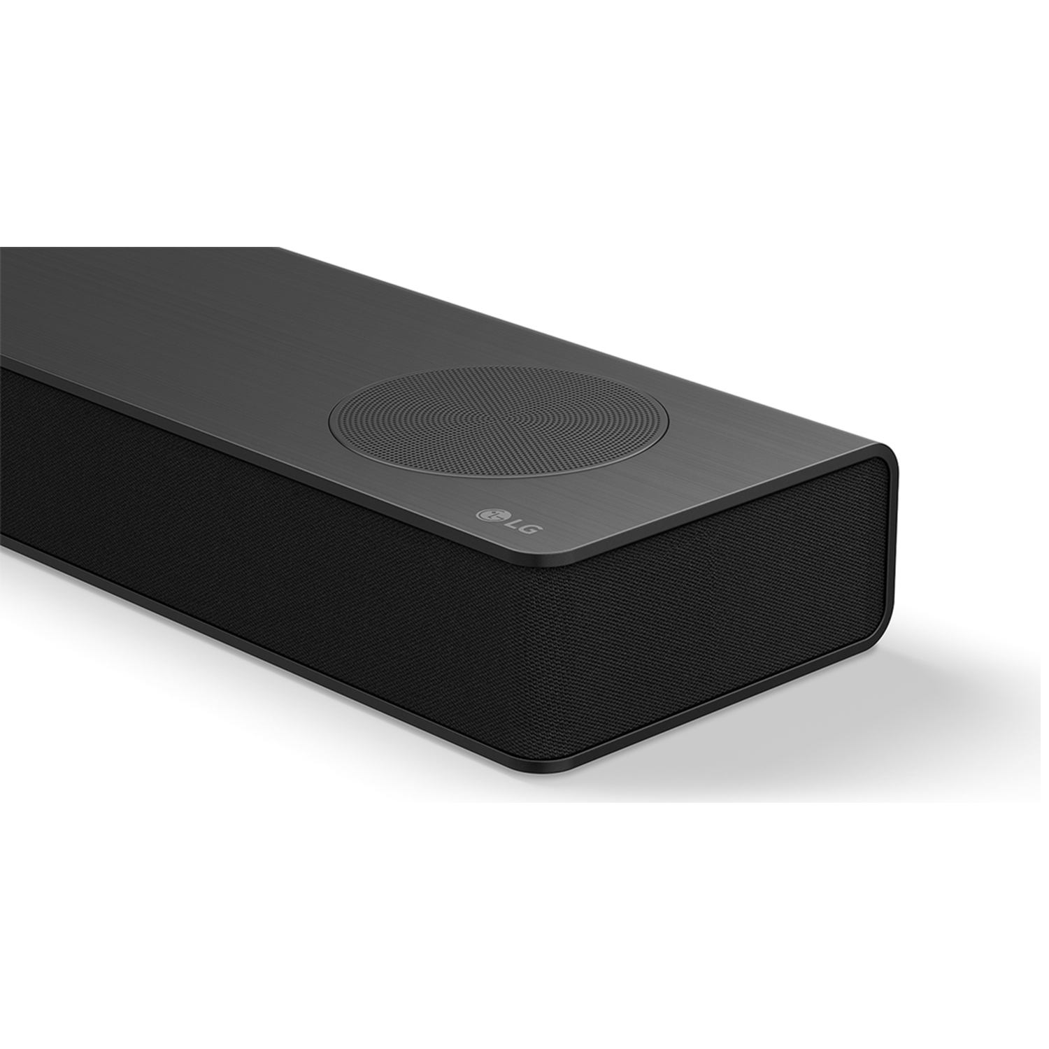 Zwarte LG speaker met grille en LG logo op geborsteld oppervlak.