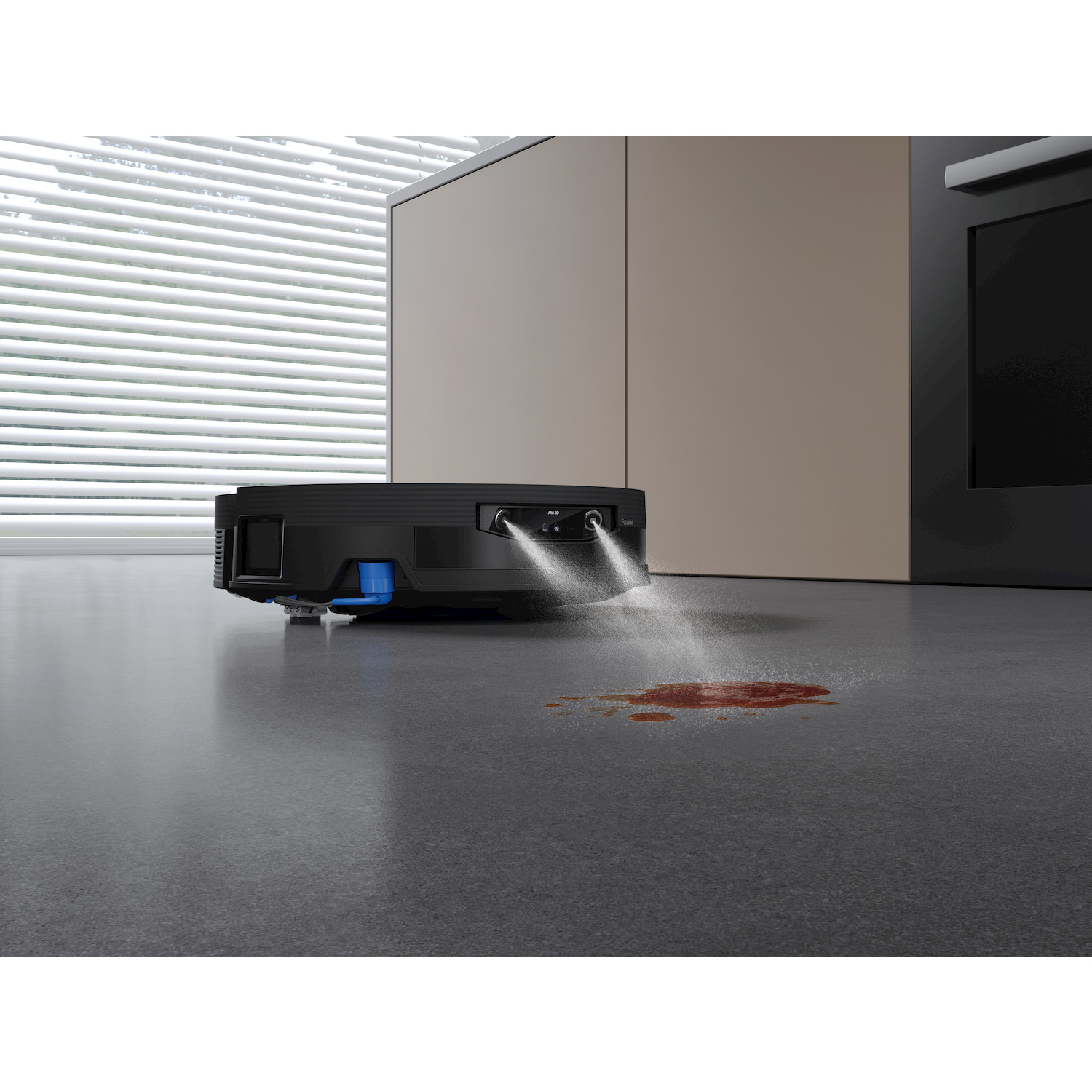 Un robot aspirapolvere nero spruzza liquido su una macchia rossa sul pavimento.