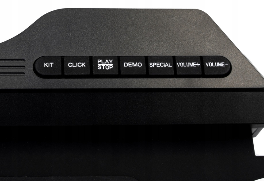 Czarny sprzęt elektroniczny z przyciskami: KIT, CLICK, PLAY/STOP, DEMO, SPECIAL, VOLUME+, VOLUME-.