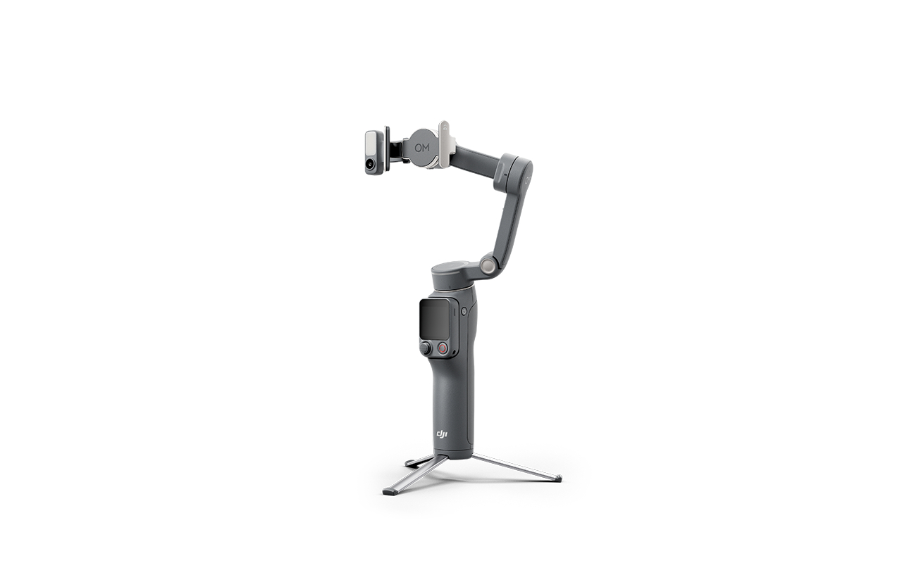 Grauer Gimbal-Stabilisator mit Stativ und Smartphone-Halterung.
