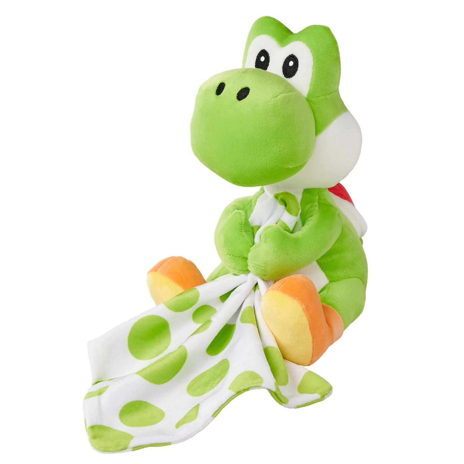 Grüner Yoshi Plüsch mit weißer Decke mit grünen Punkten.