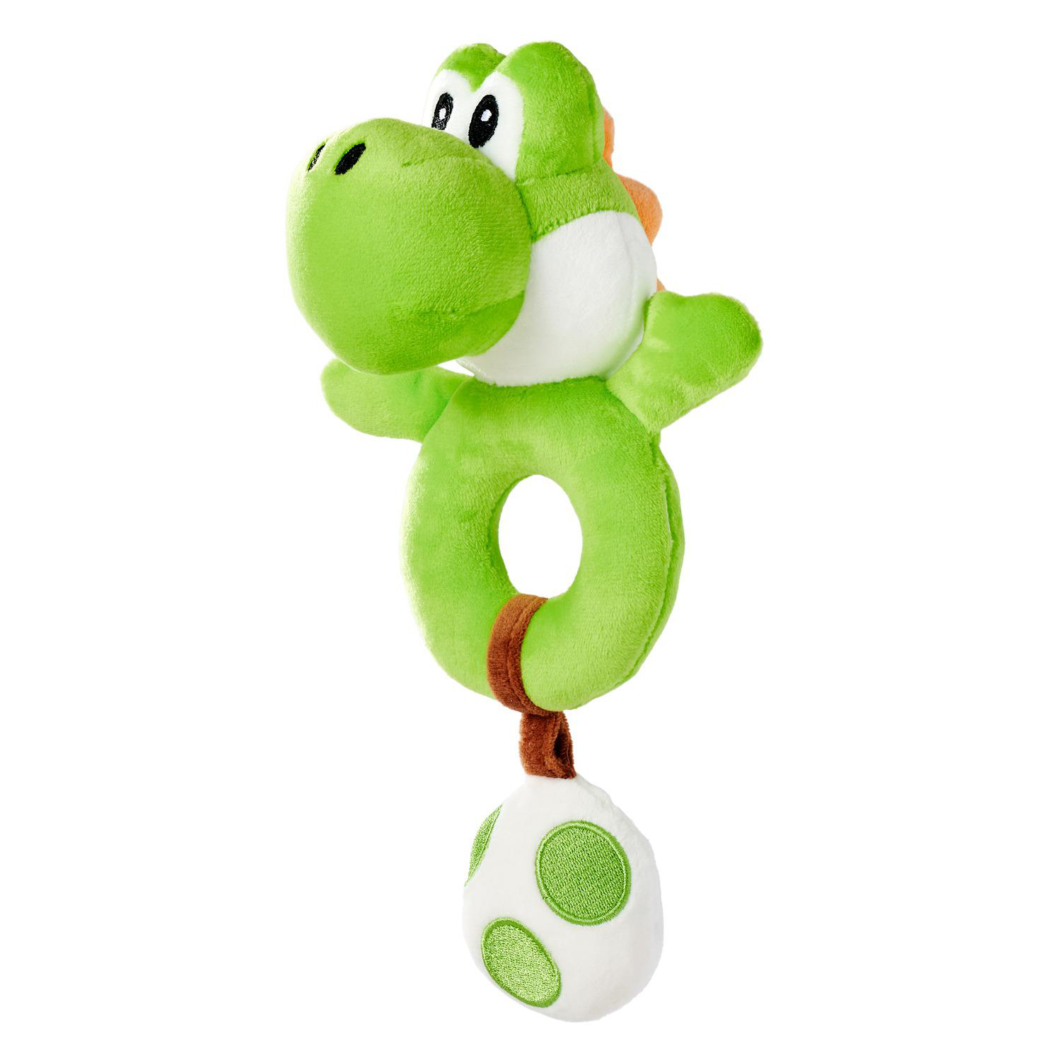 Ein grünes Plüsch-Yoshi-Spielzeug mit Ring und Ei.