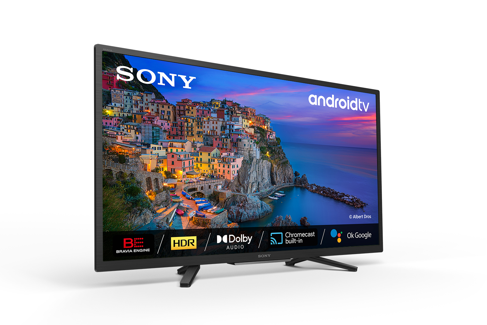 Telewizor Sony z Android TV wyświetlający kolorowe miasteczko nad morzem.