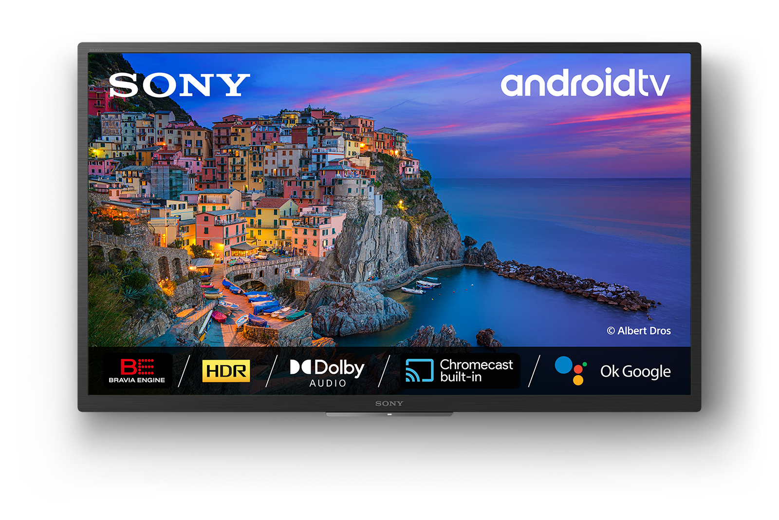 Sony Android TV wyświetla nadmorskie miasteczko o zachodzie słońca z HDR i Dolby Audio.