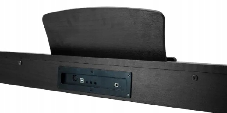 Tył ciemnego pianina z portami: USB, MIDI i zasilacz.