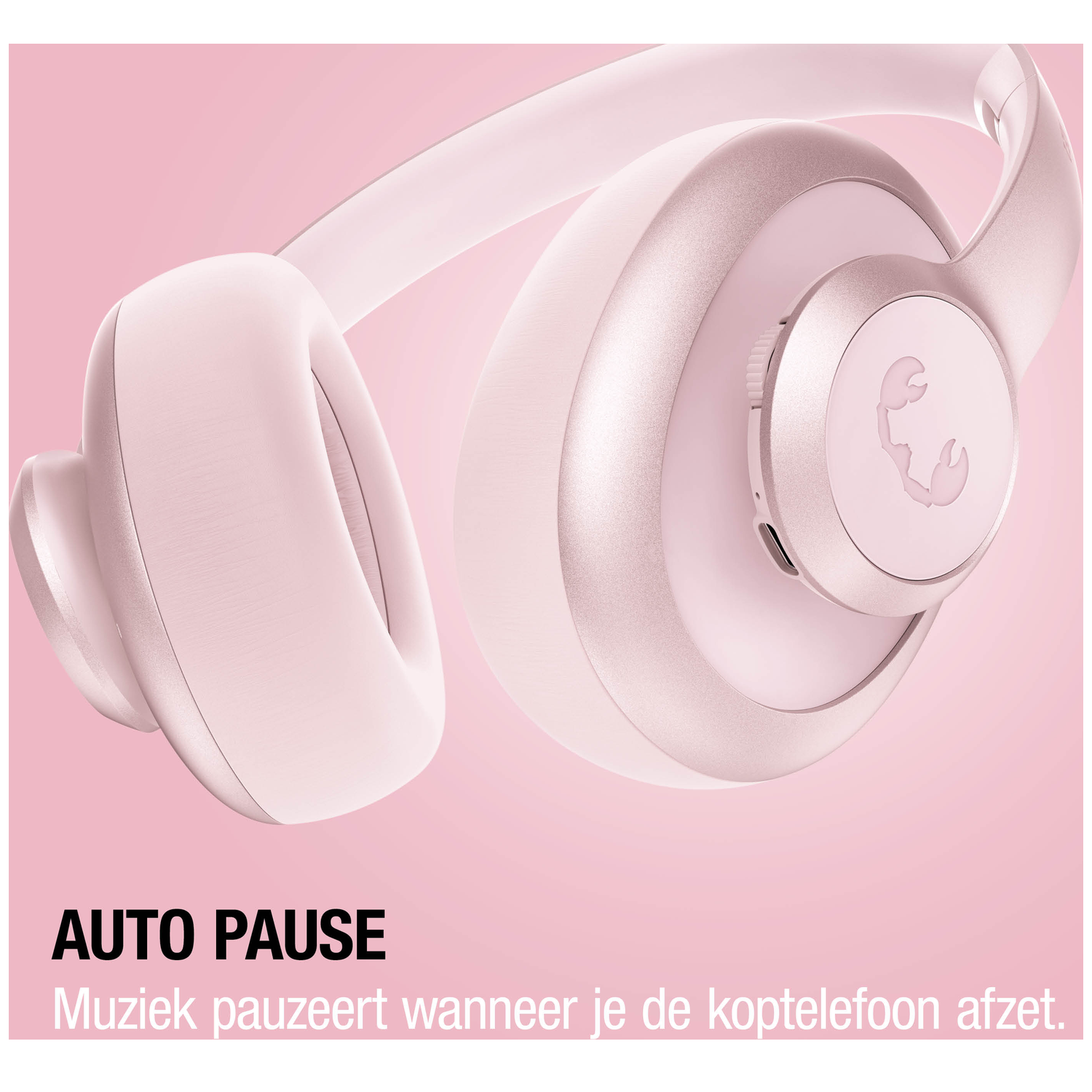A pair of pink headphones with a scorpion logo and text.
