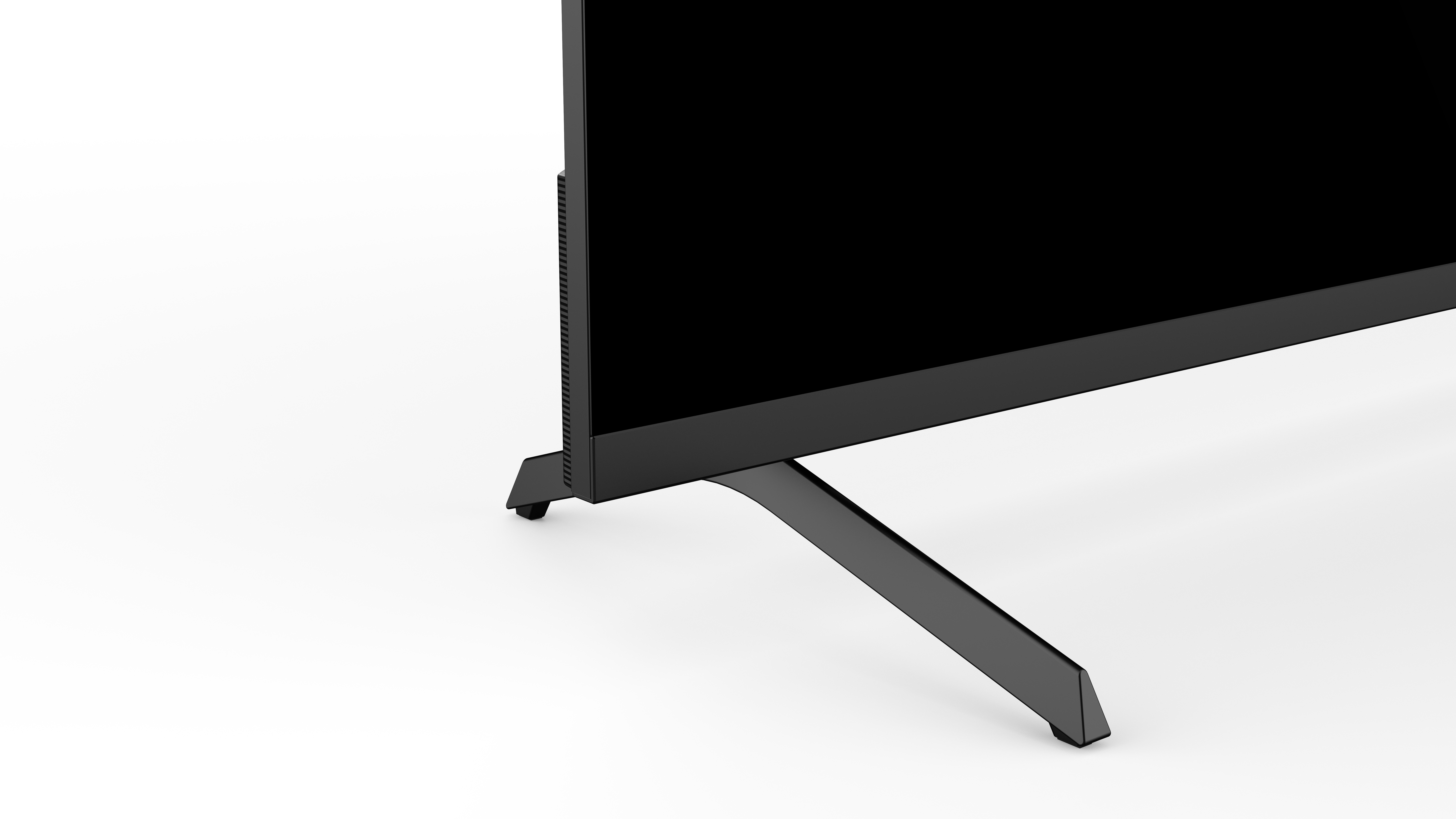 Der untere Teil eines schwarzen Fernsehers mit einem schlanken Ständer auf weißem Hintergrund.