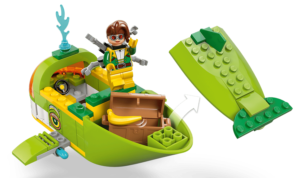 Grünes Lego-Boot mit Spielfigur, Truhe, Banane und blauem Flammenaufsatz.