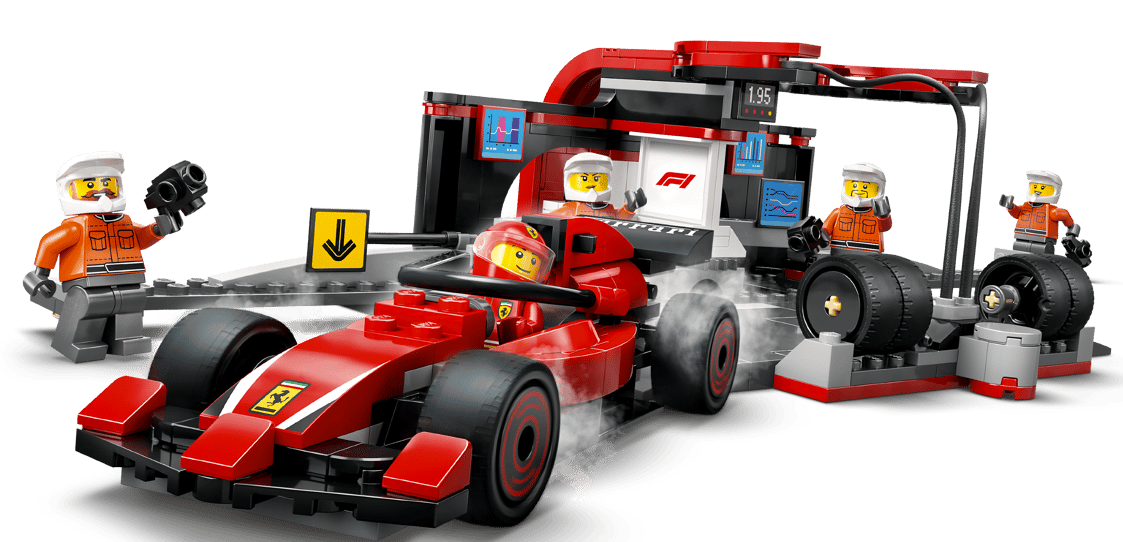 Ein roter Lego-Rennwagen mit Fahrer, der von Mechanikern in einer Boxengasse mit Werkzeugen repariert wird.