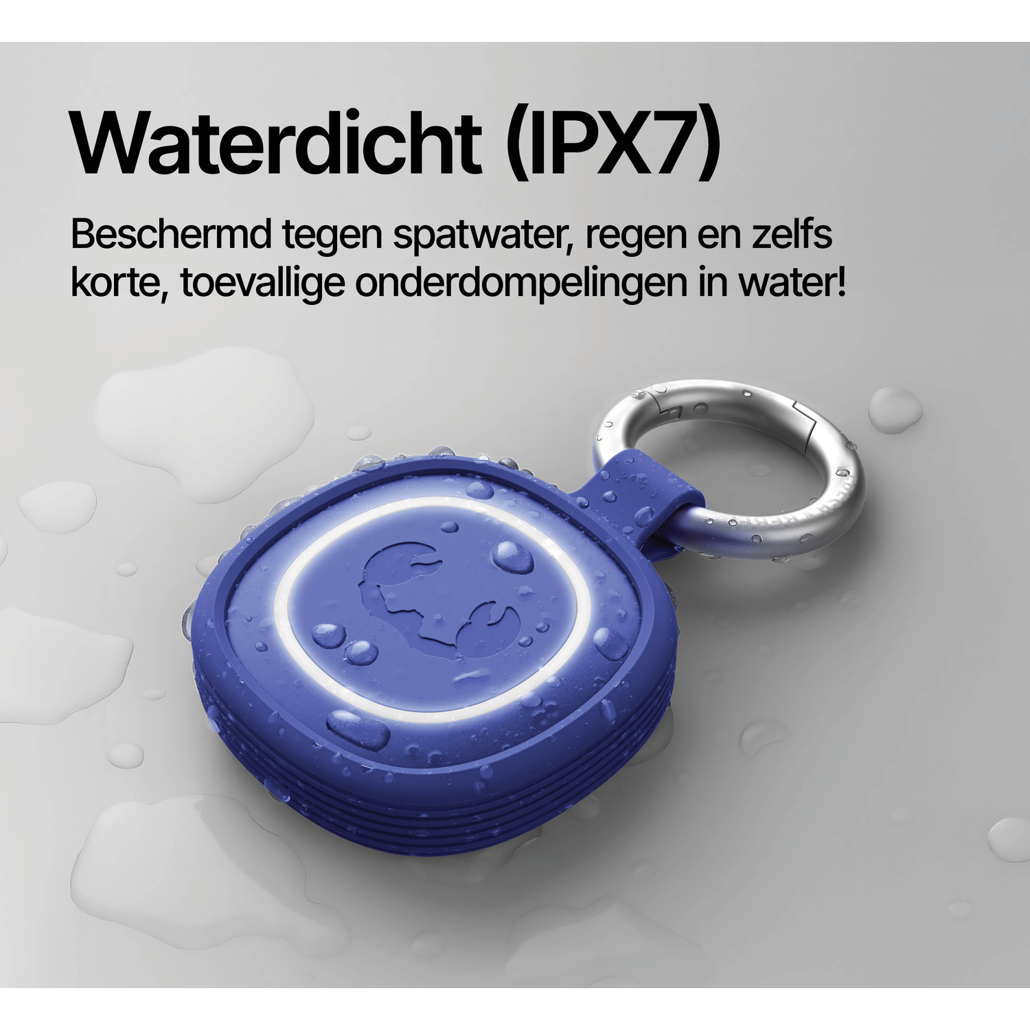 A waterproof blue speaker with a carabiner clip on a wet surface.