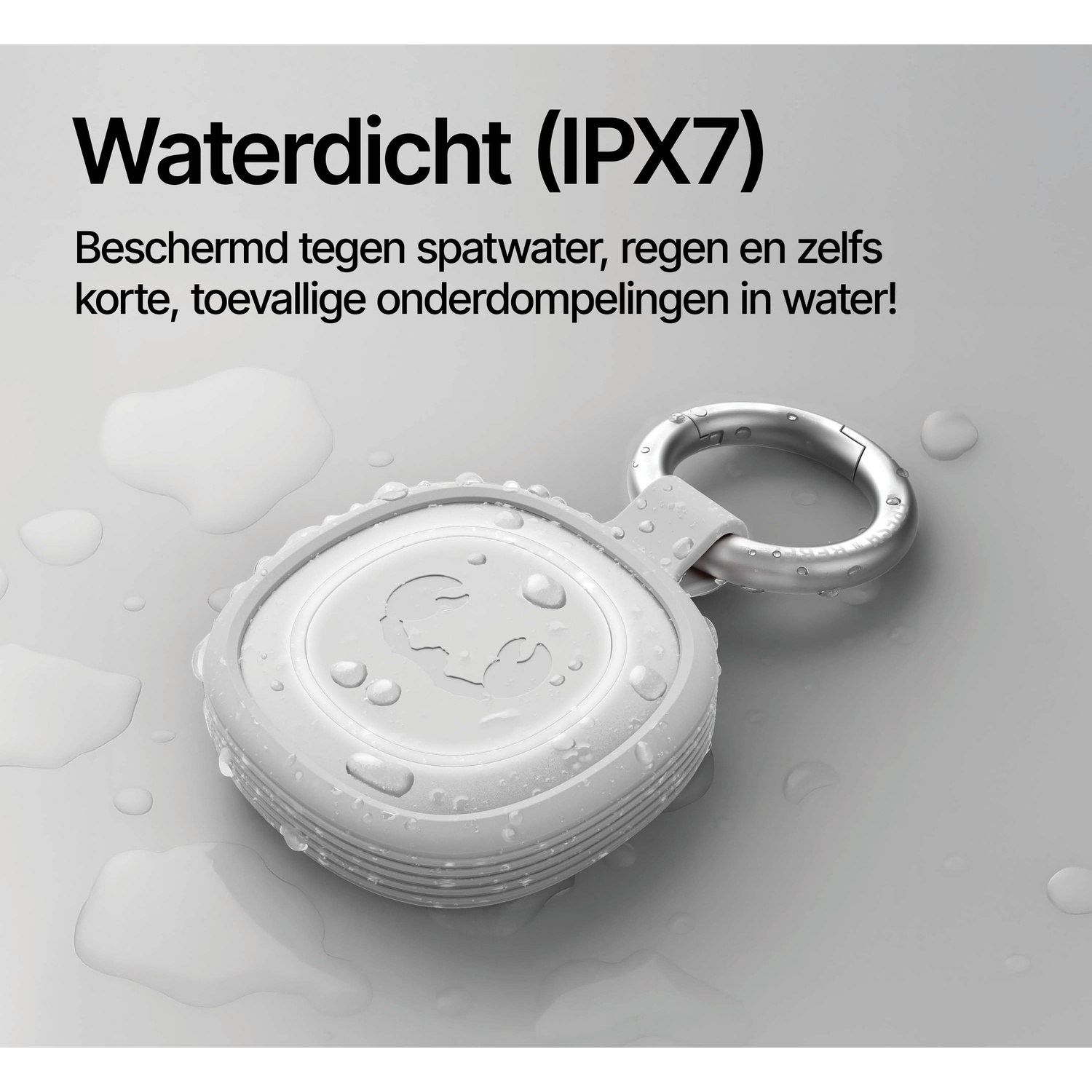 A white, waterproof device with a metal ring rests on a wet surface.