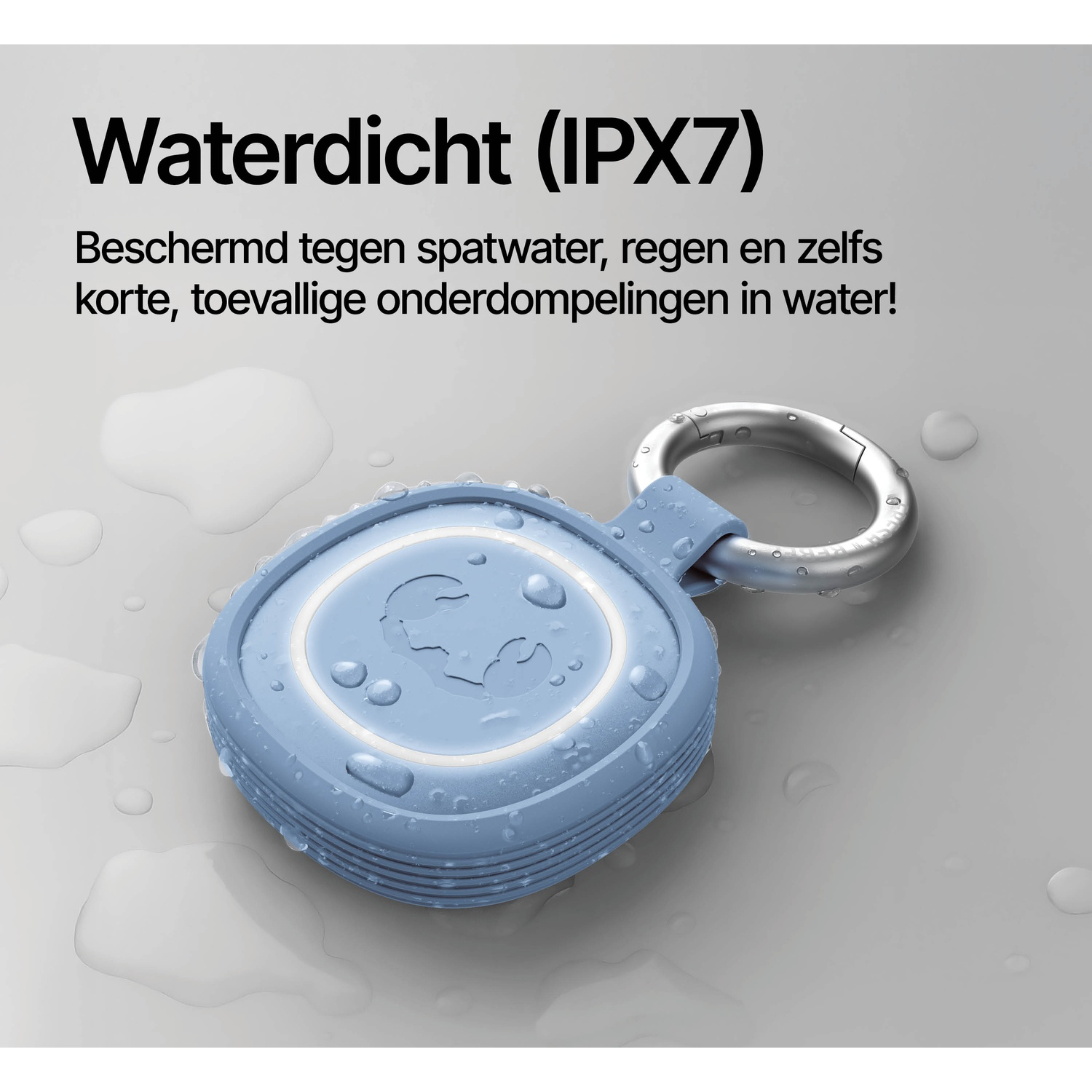 A light blue, waterproof device with a metal ring lies on a wet surface.