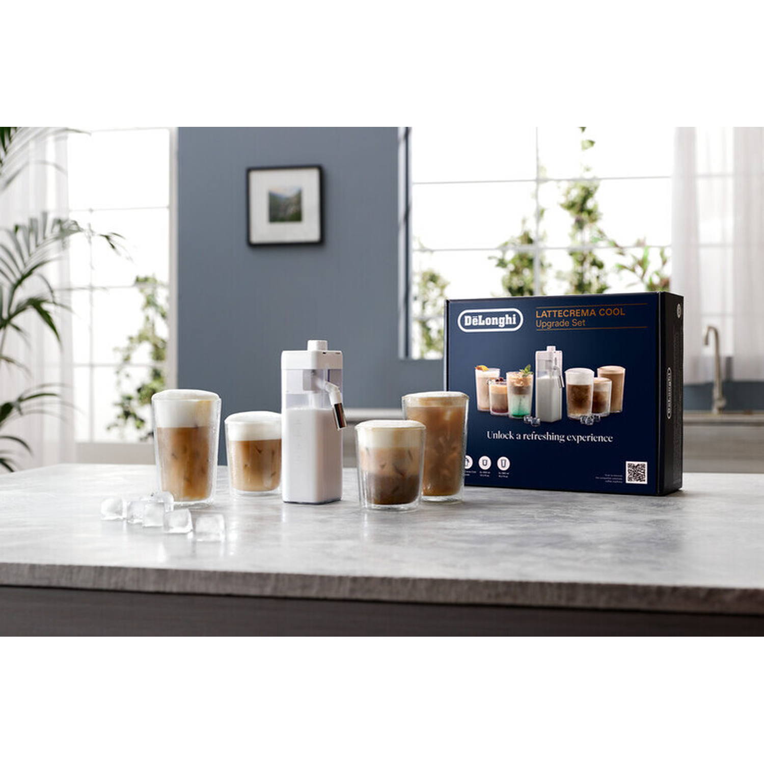 DeLonghi Lattecrema Cool Upgrade Set with glasses and ice cubes on a table.