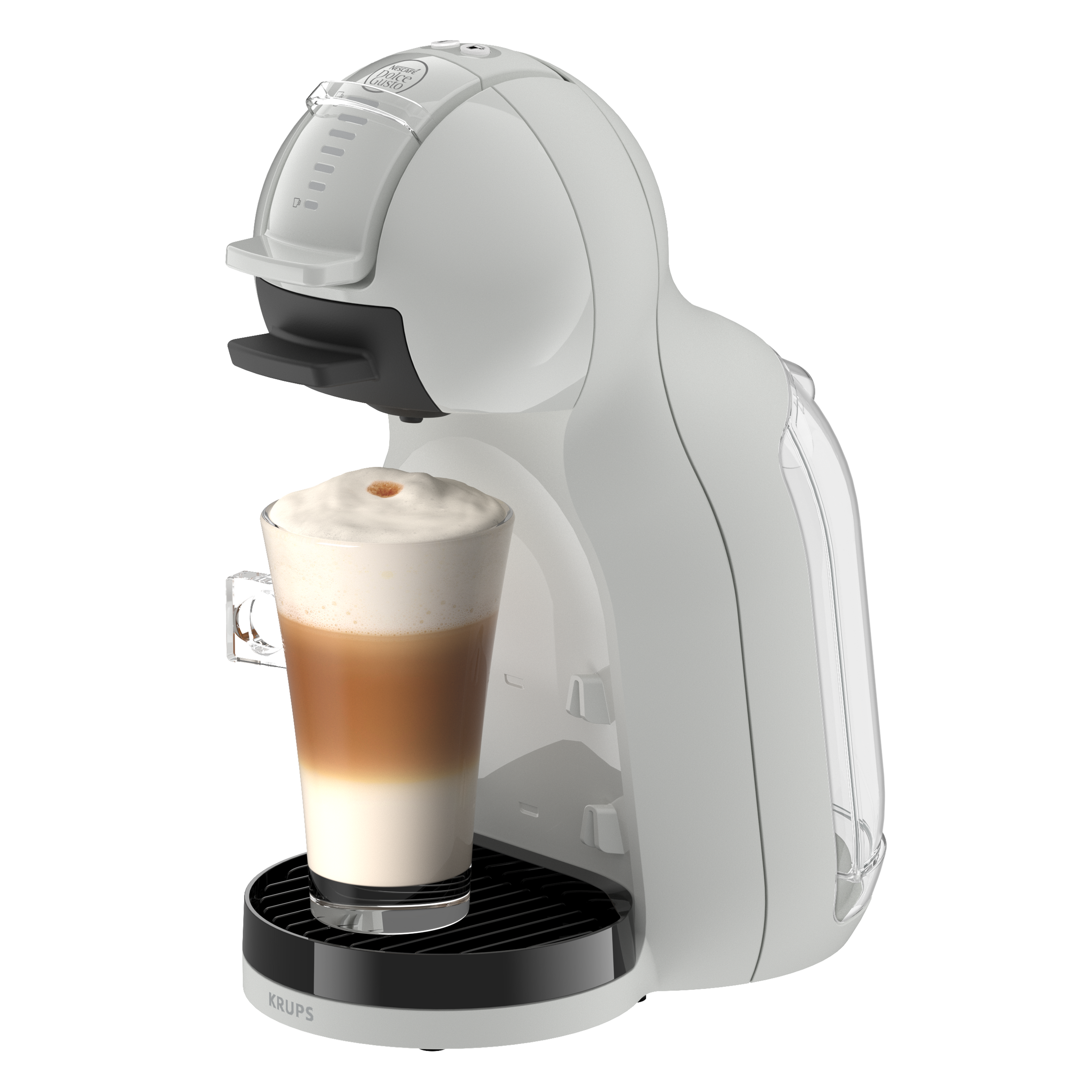 Cafetera blanca con un vaso de latte macchiato.