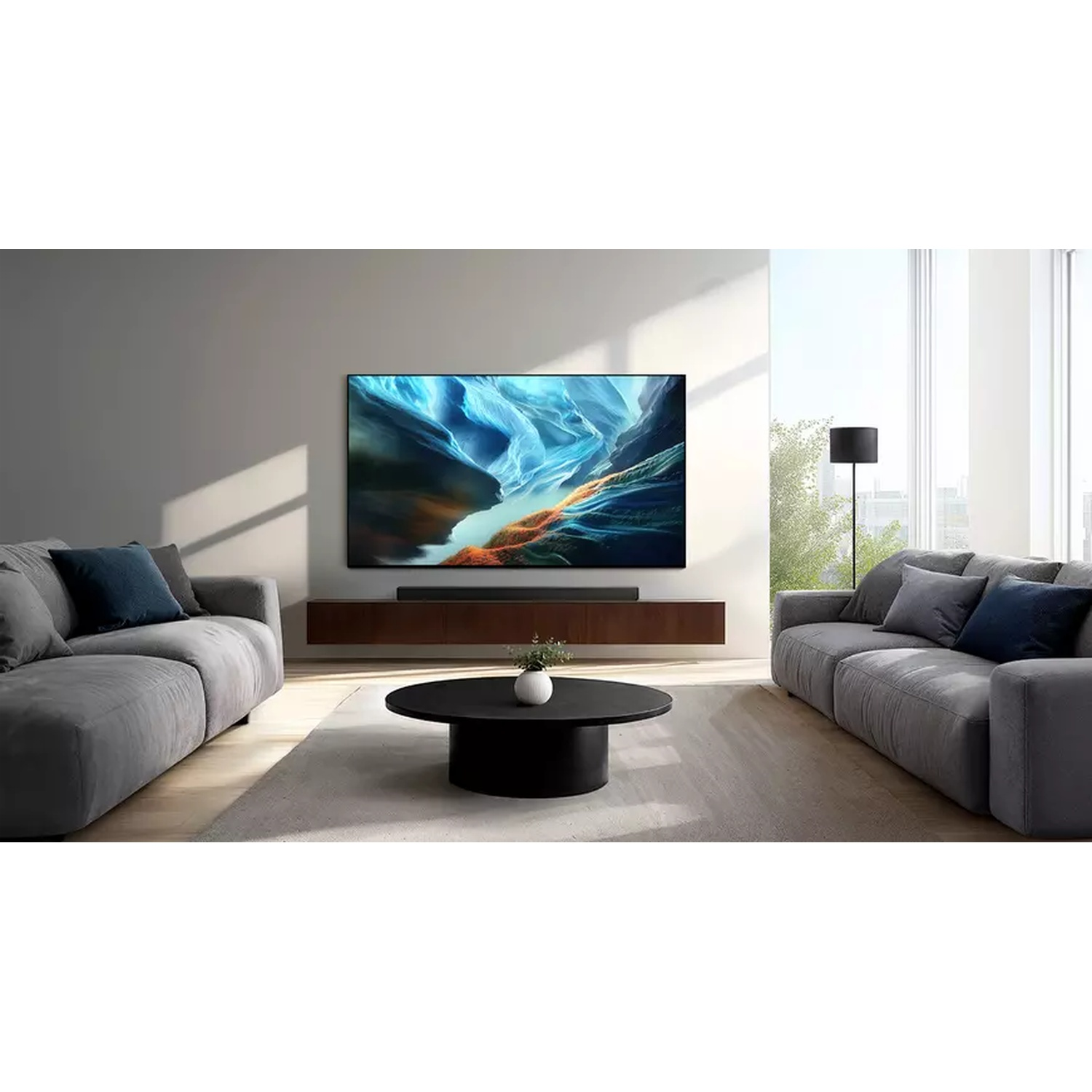 Modern living room with two grey sofas, coffee table, TV, and lamp.