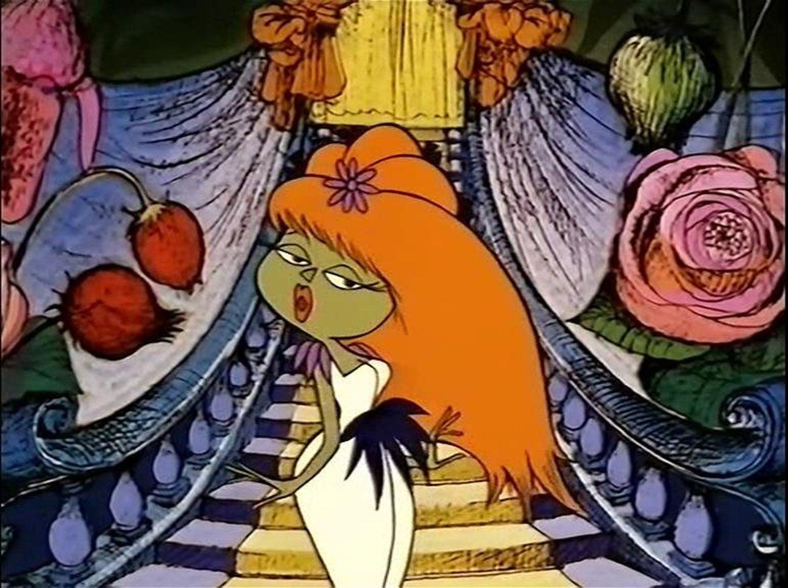 Cartoon-Figur mit orangefarbenem Haar, grünem Gesicht, weißem Kleid, steht auf Treppen.